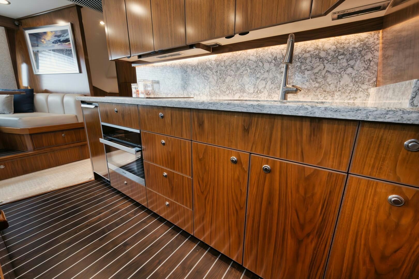 a kitchen with wooden cabinets aboard DOUBLE SHOT Yacht for Sale