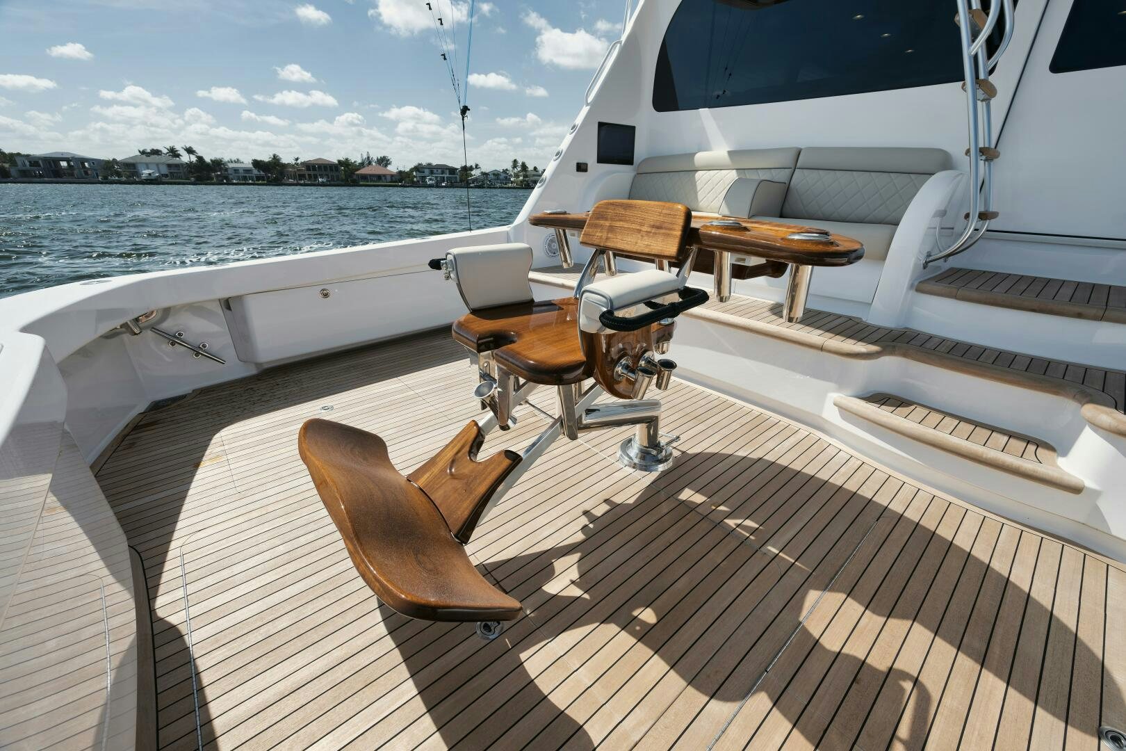 a deck with chairs and a table on it aboard DOUBLE SHOT Yacht for Sale