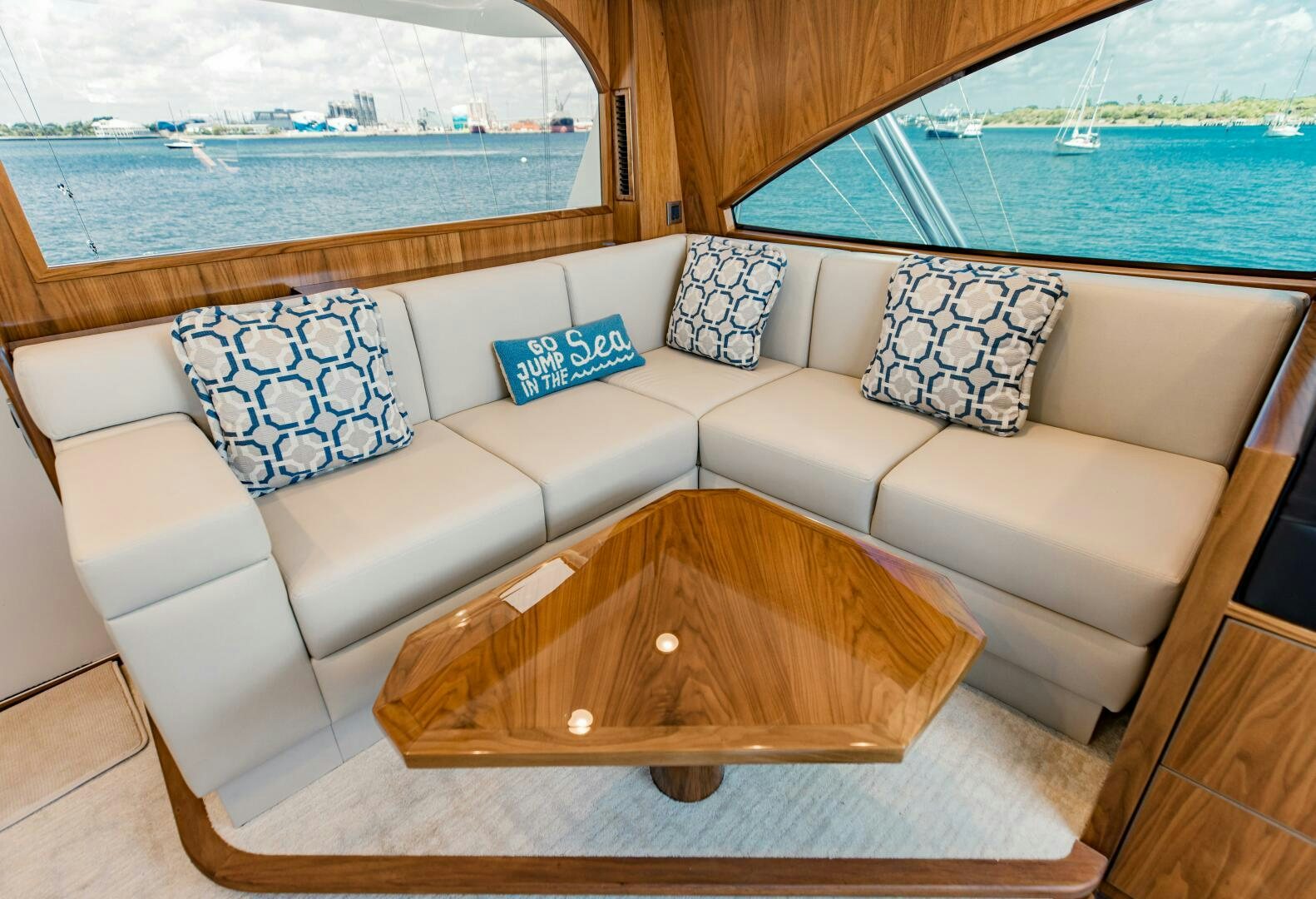 a couch with pillows on it aboard DOUBLE SHOT Yacht for Sale
