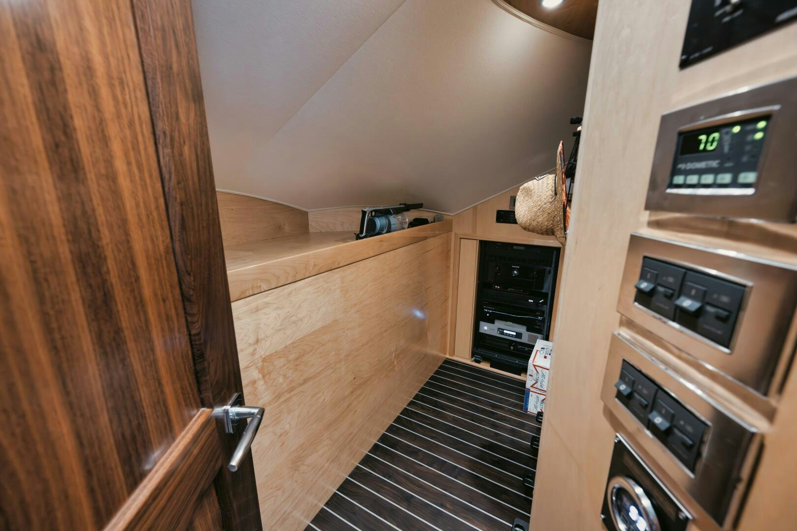 a kitchen with wooden cabinets aboard DOUBLE SHOT Yacht for Sale