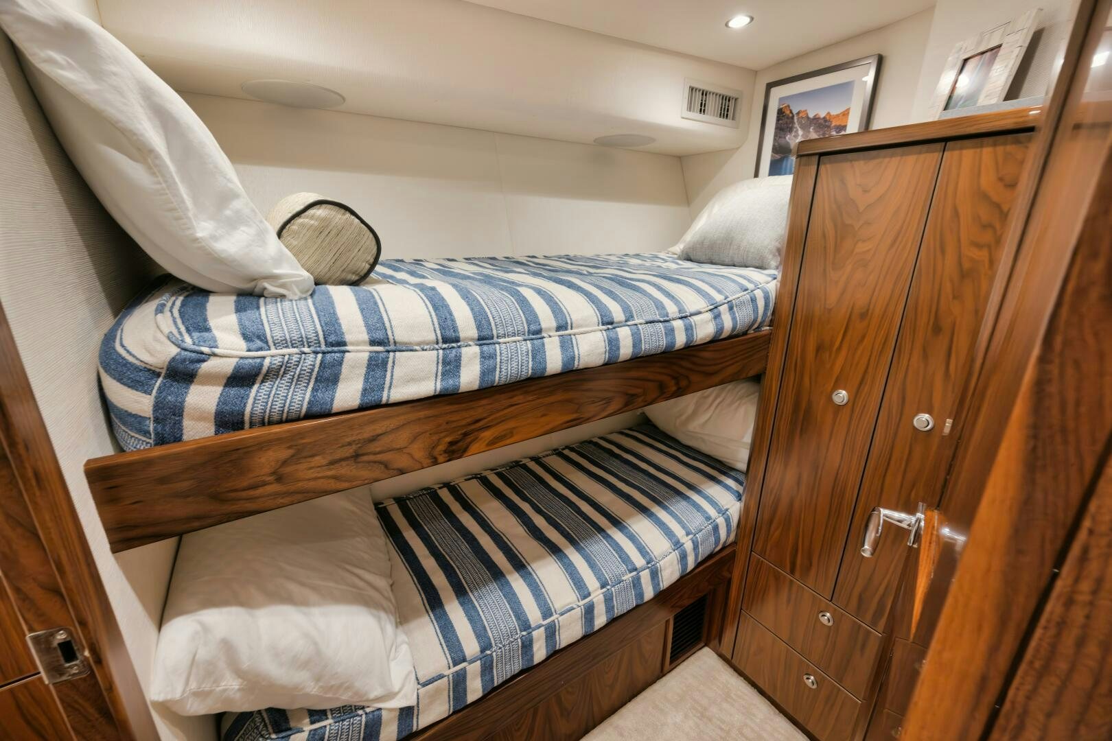 a bed with a wooden headboard aboard DOUBLE SHOT Yacht for Sale