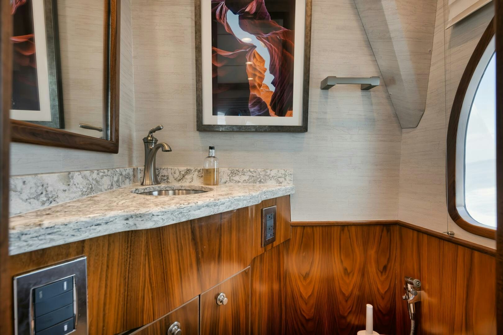a bathroom with a sink and a mirror aboard DOUBLE SHOT Yacht for Sale