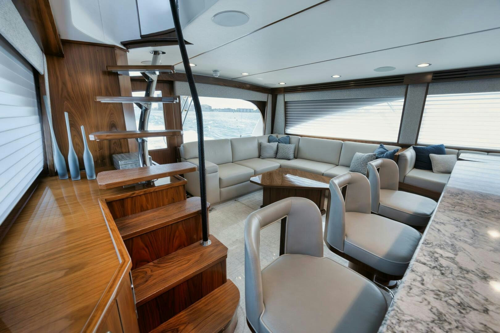 a room with a large window and a view of the ocean aboard DOUBLE SHOT Yacht for Sale