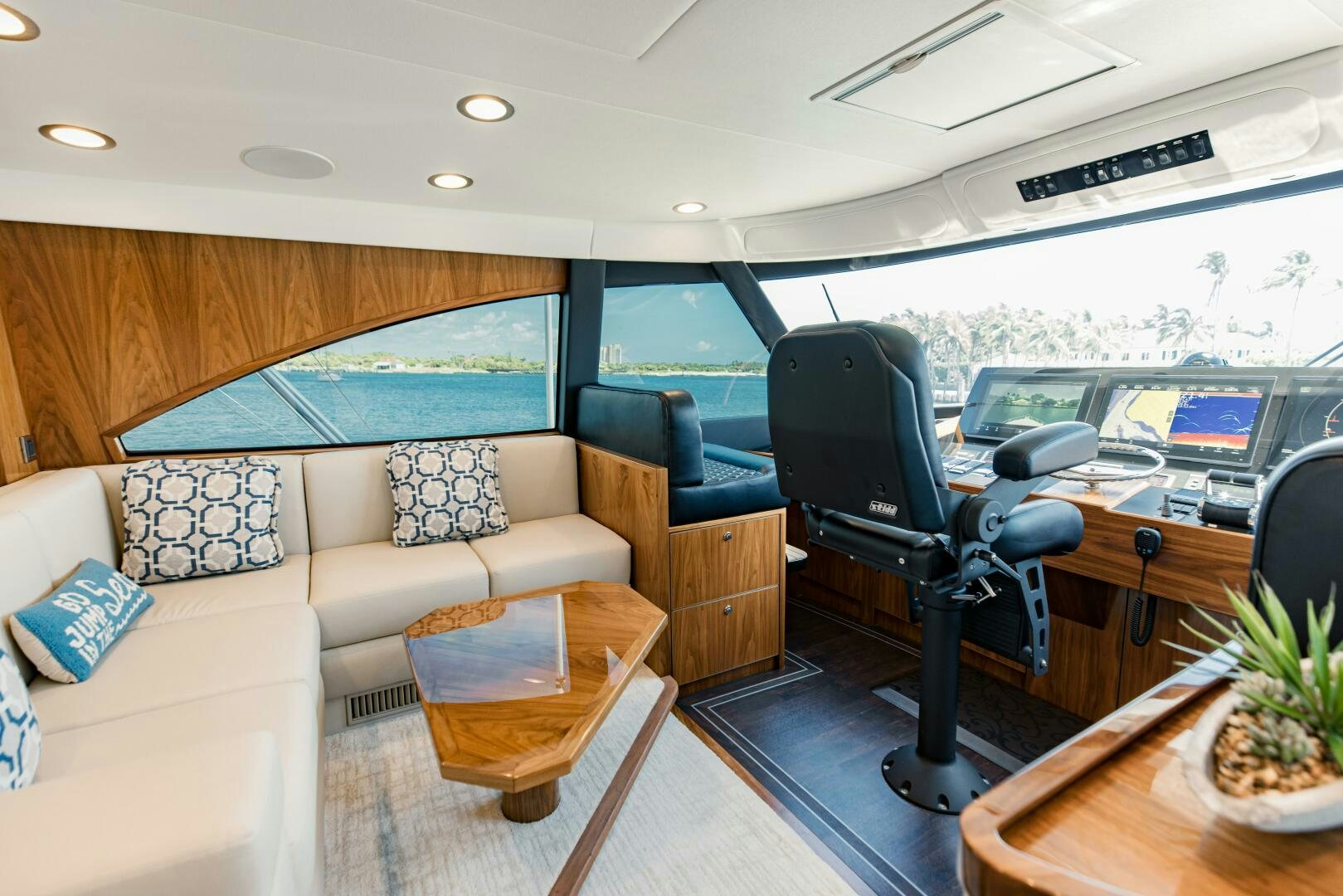 a living room with a couch and a table aboard DOUBLE SHOT Yacht for Sale