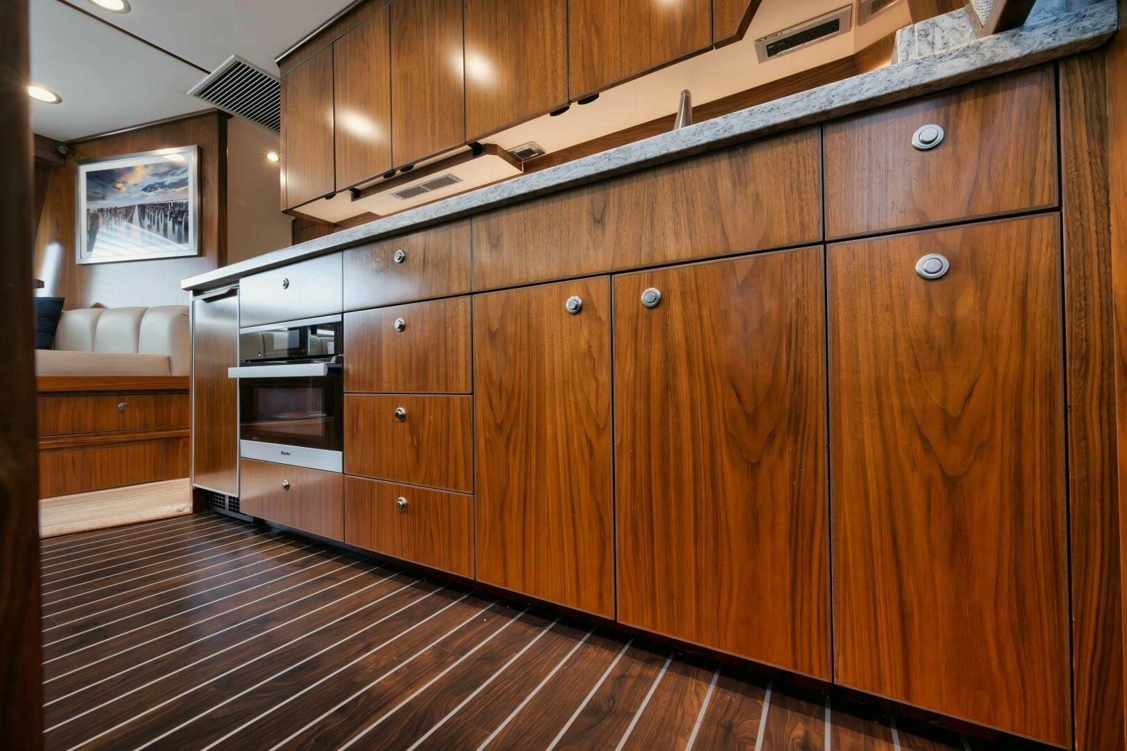 a kitchen with wooden cabinets aboard DOUBLE SHOT Yacht for Sale