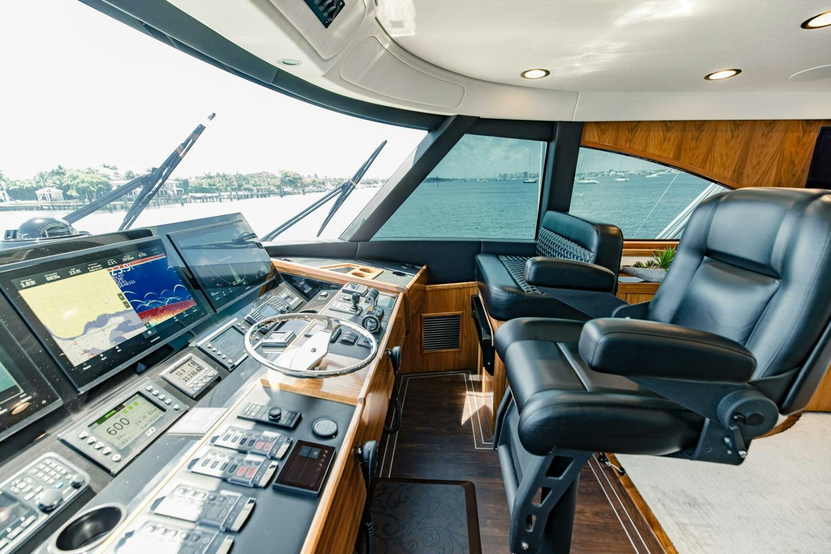 inside of a vehicle with a view of the city and the water aboard DOUBLE SHOT Yacht for Sale