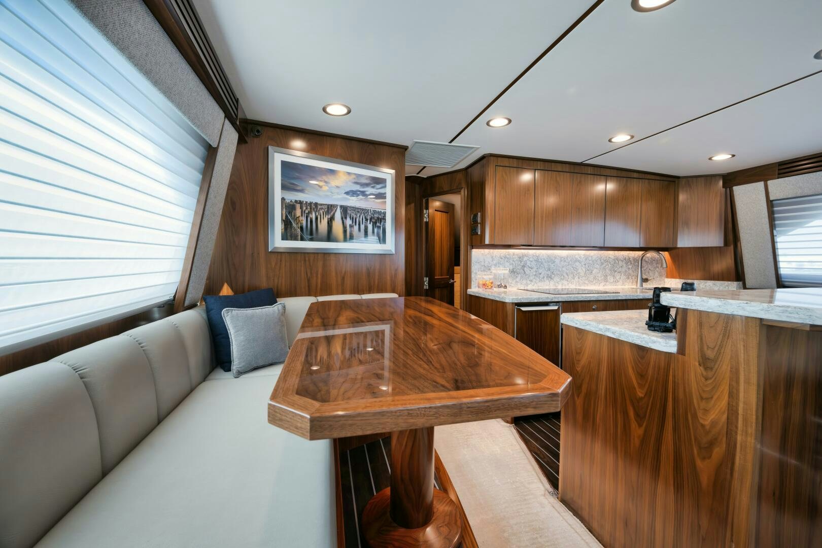 a living room with a couch and a table aboard DOUBLE SHOT Yacht for Sale