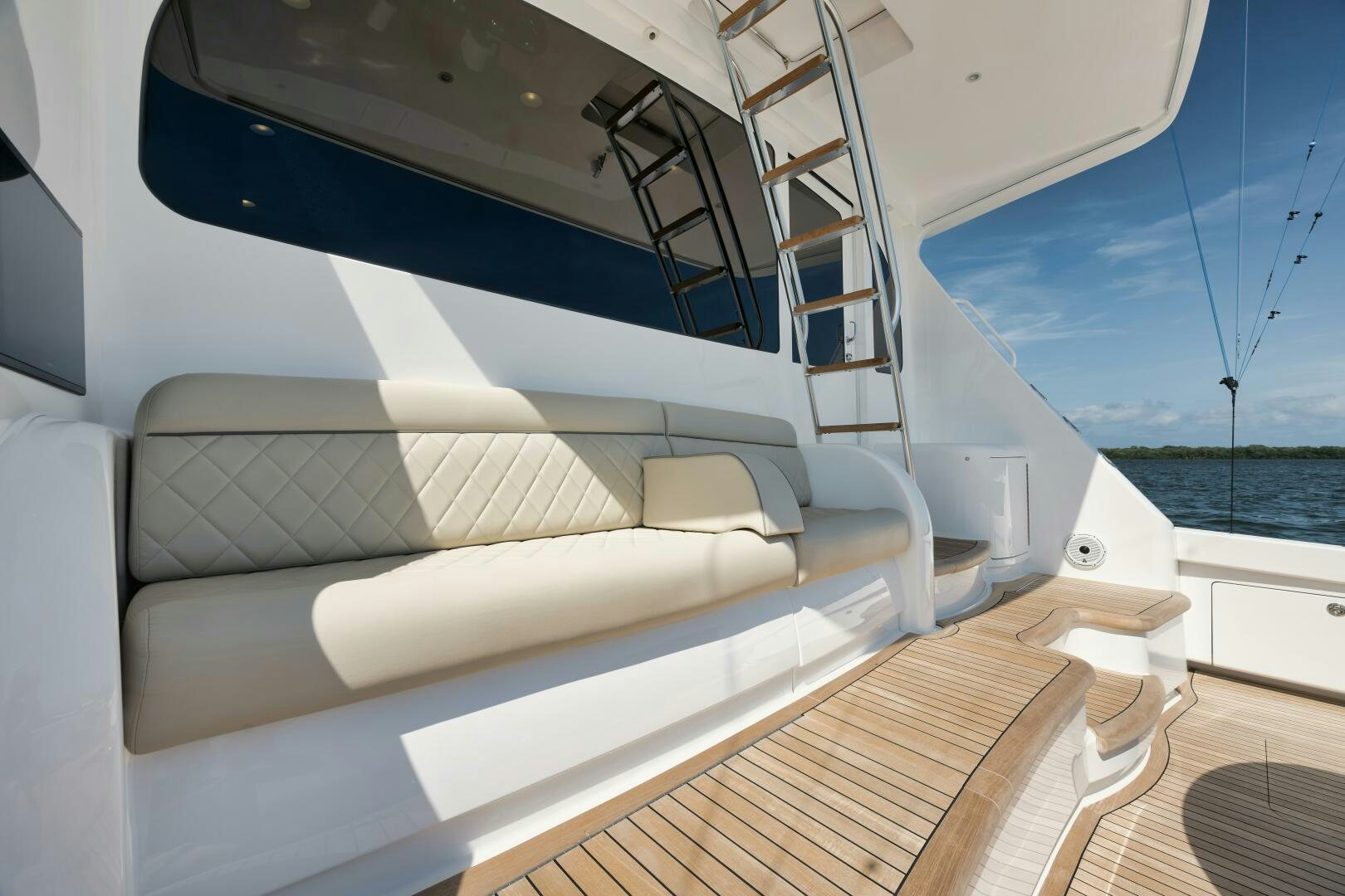 a white couch on a boat aboard DOUBLE SHOT Yacht for Sale