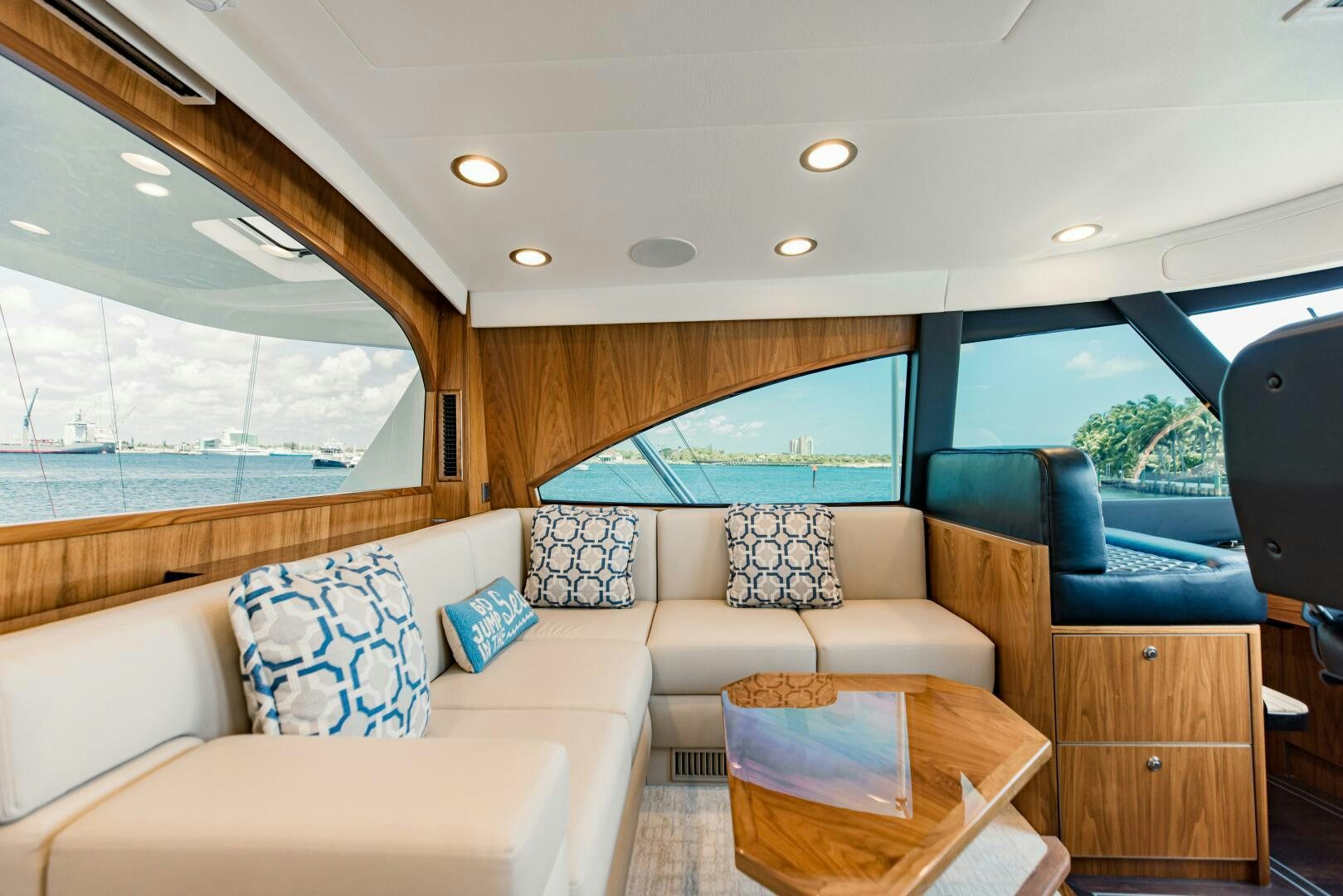 a living room with a large window aboard DOUBLE SHOT Yacht for Sale
