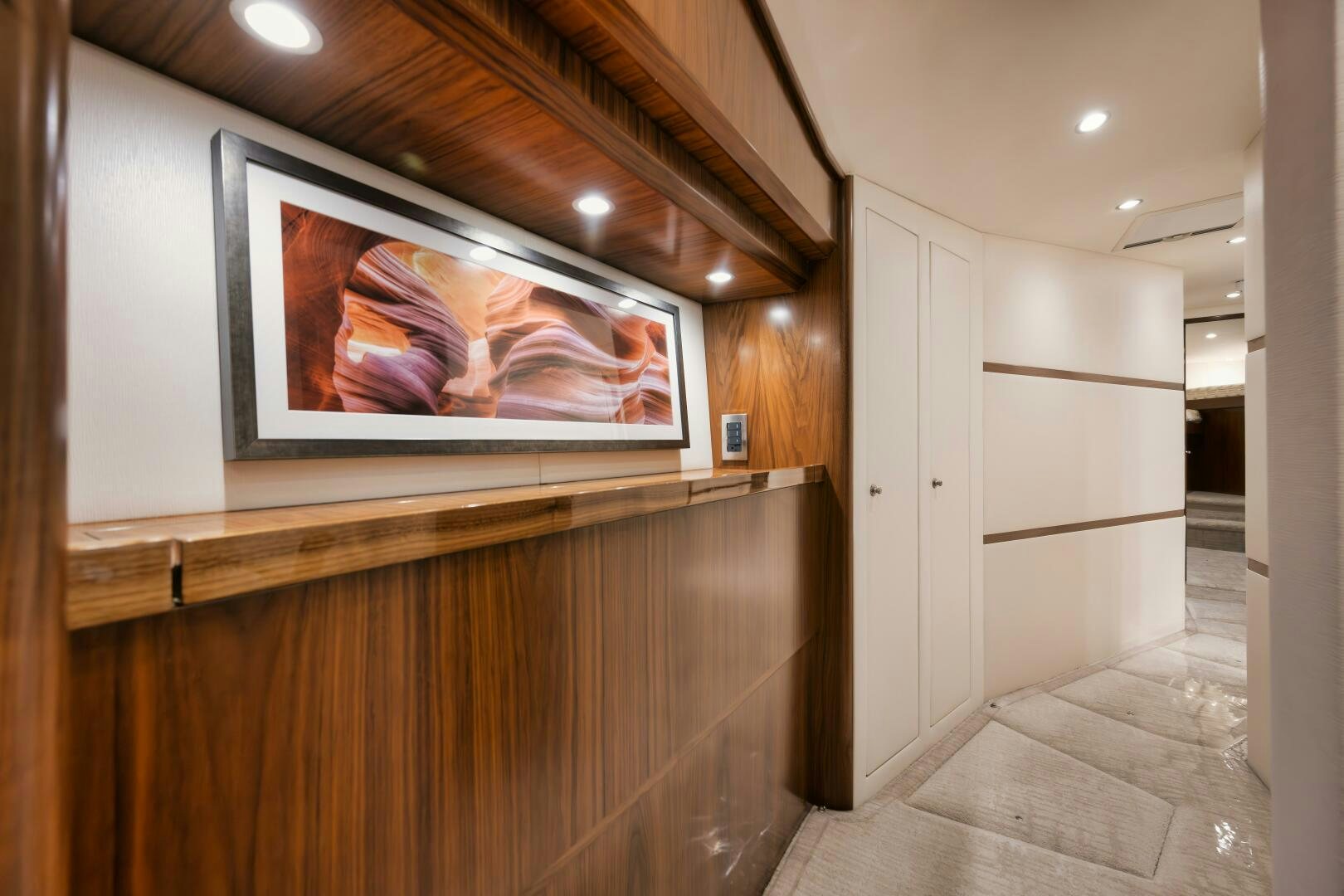 a room with a tv on the wall aboard DOUBLE SHOT Yacht for Sale