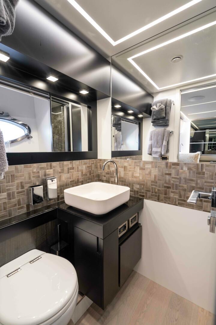 a bathroom with a sink and a toilet aboard STALLION Yacht for Sale