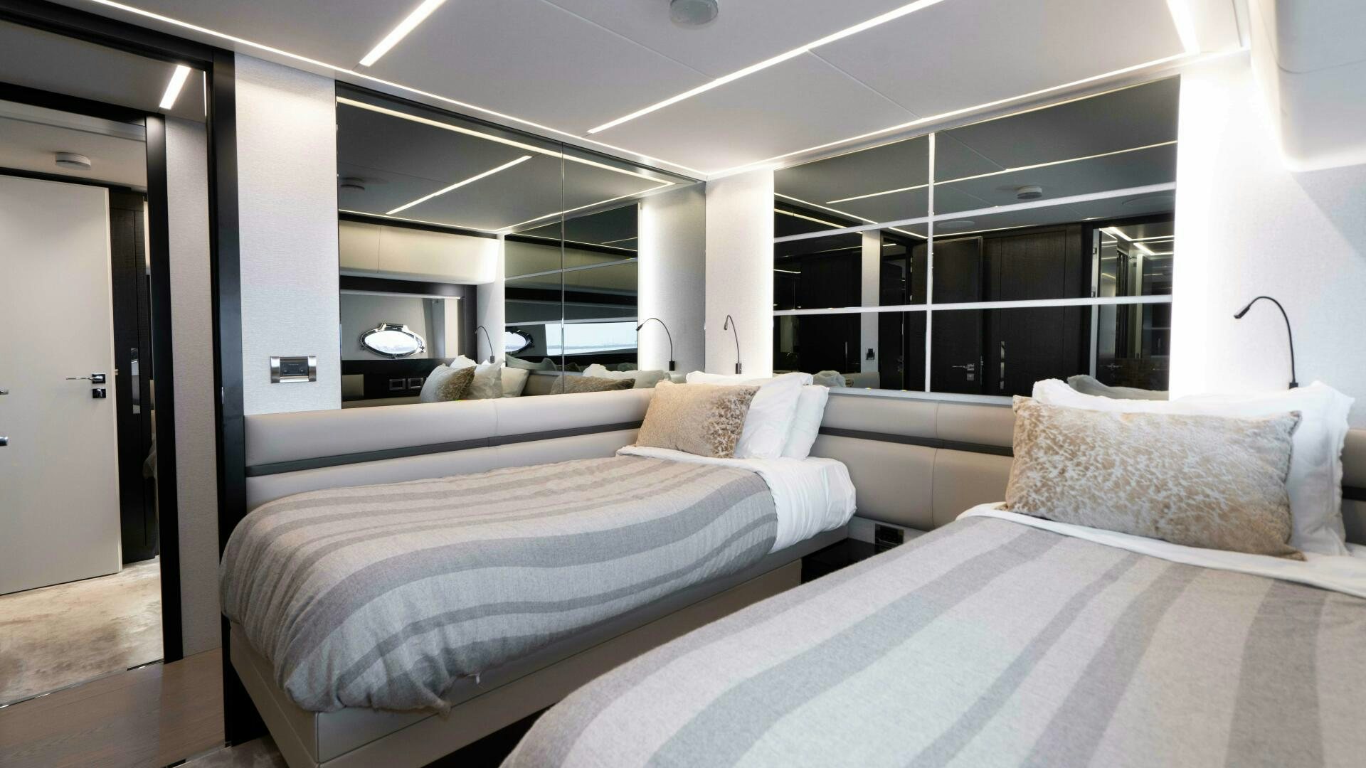 a room with two beds aboard STALLION Yacht for Sale