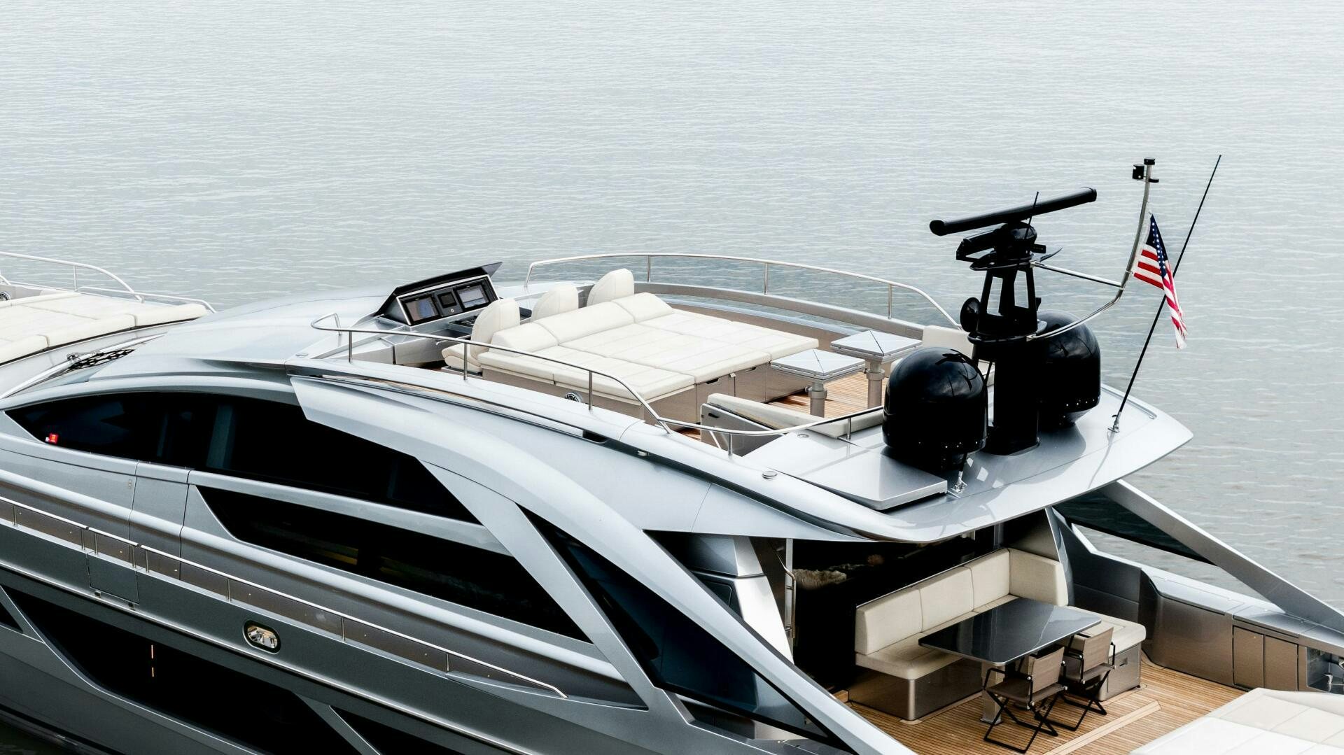 a white yacht with a gun on the deck aboard STALLION Yacht for Sale