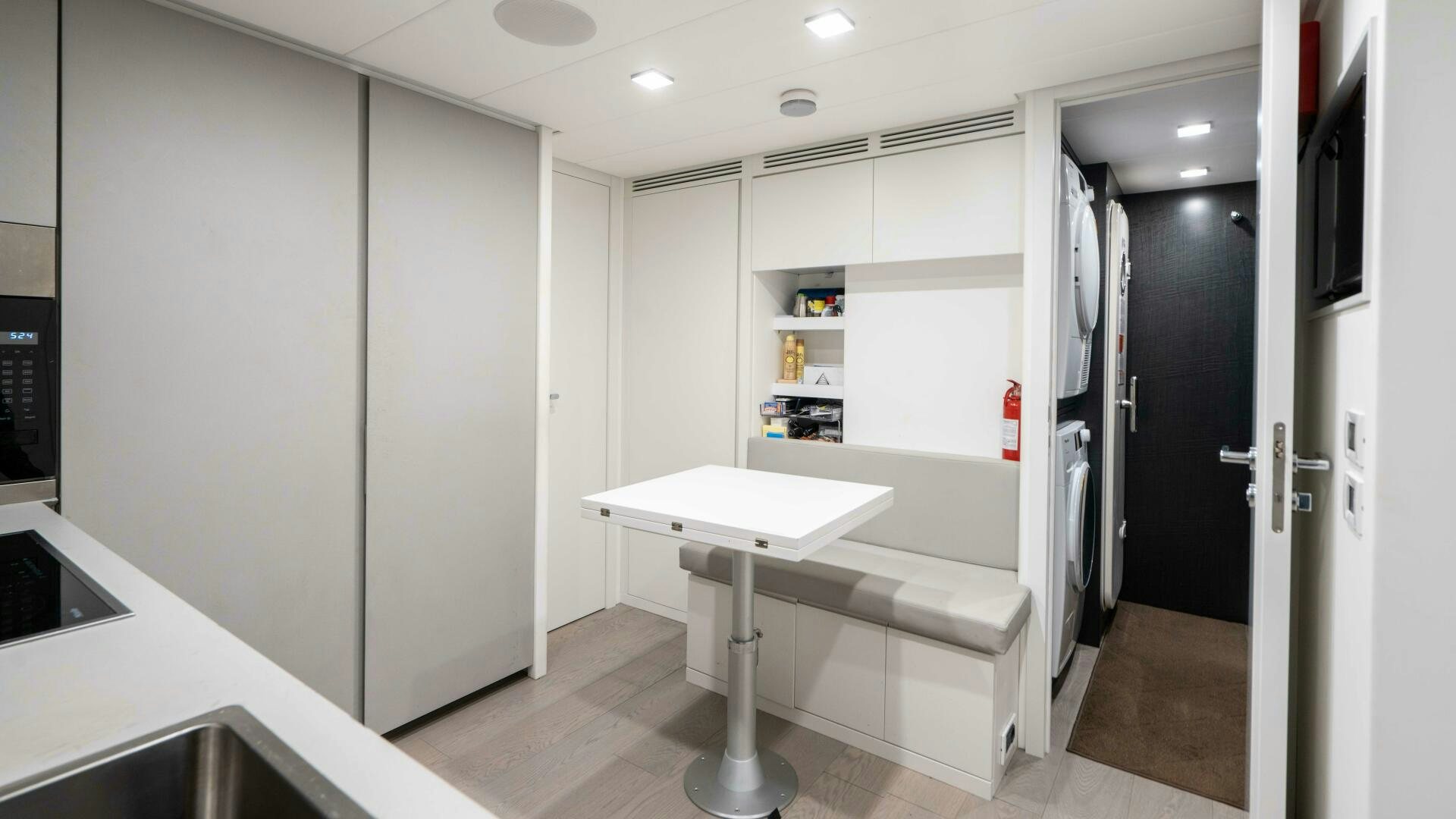 a white table in a room aboard STALLION Yacht for Sale