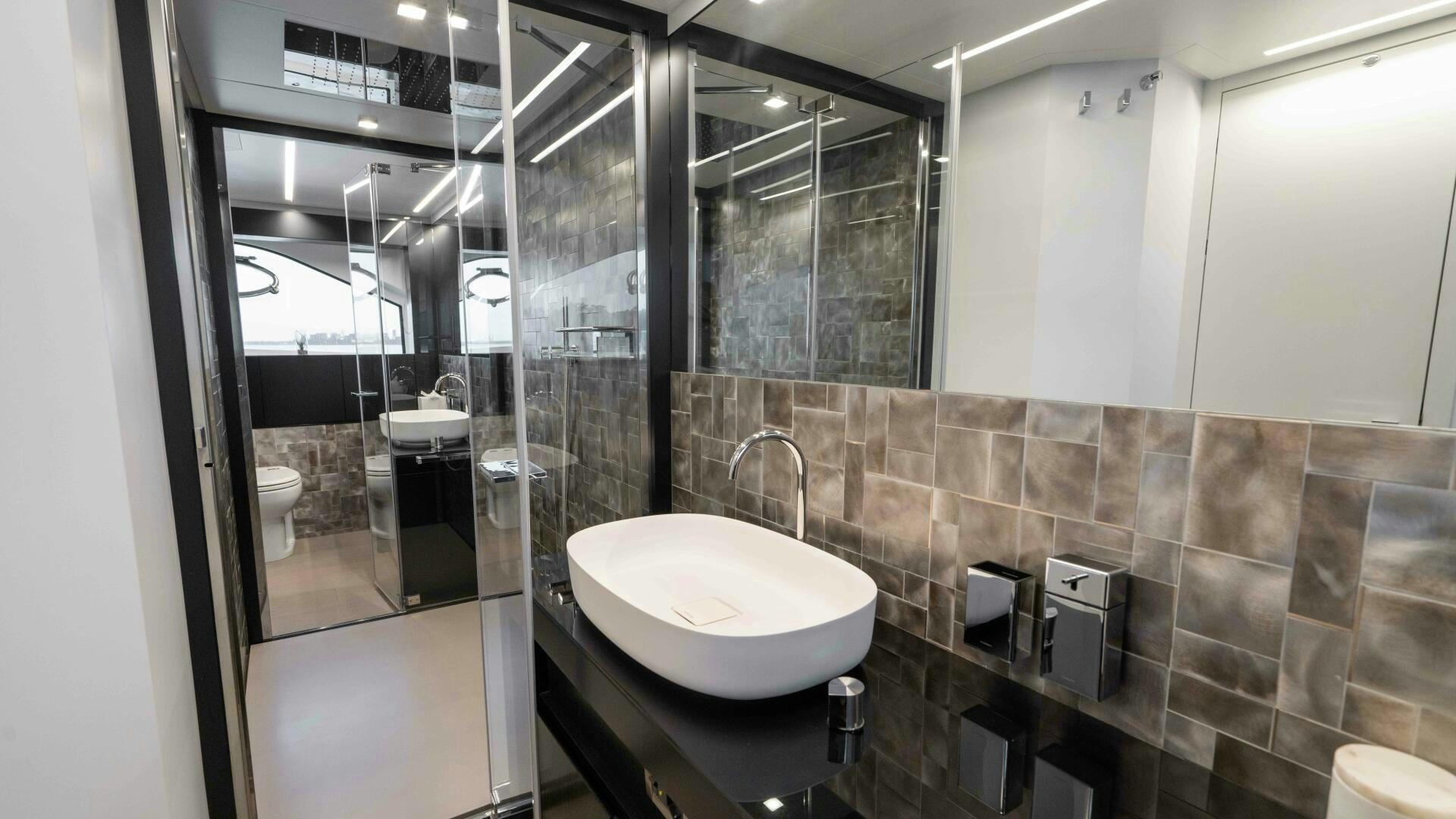 a bathroom with a sink and a mirror aboard STALLION Yacht for Sale