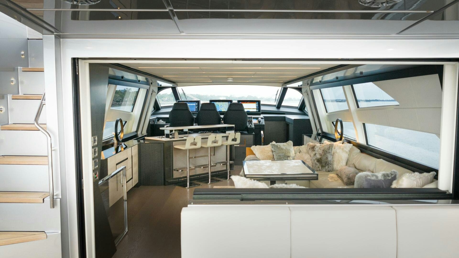 inside of a vehicle with a couch and a table and chairs aboard STALLION Yacht for Sale