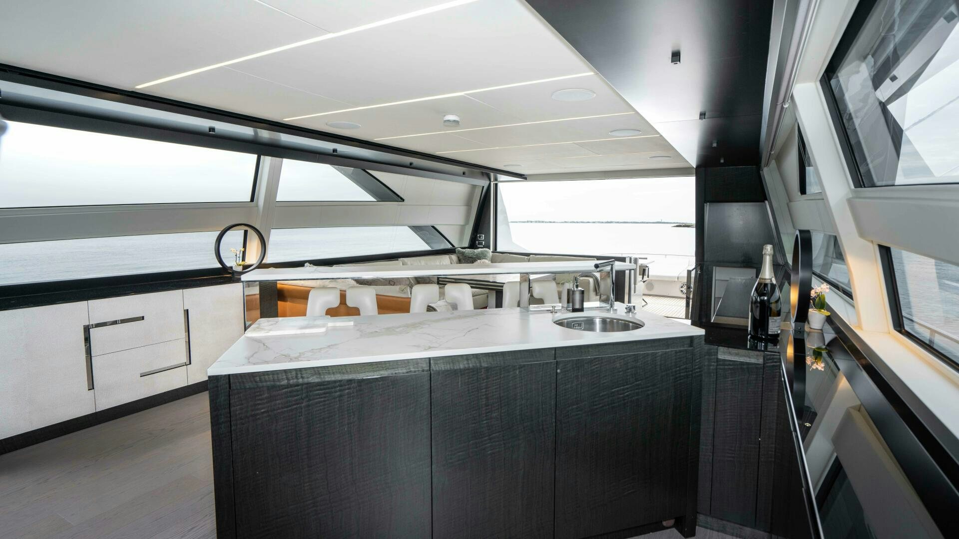 a kitchen with a large window aboard STALLION Yacht for Sale