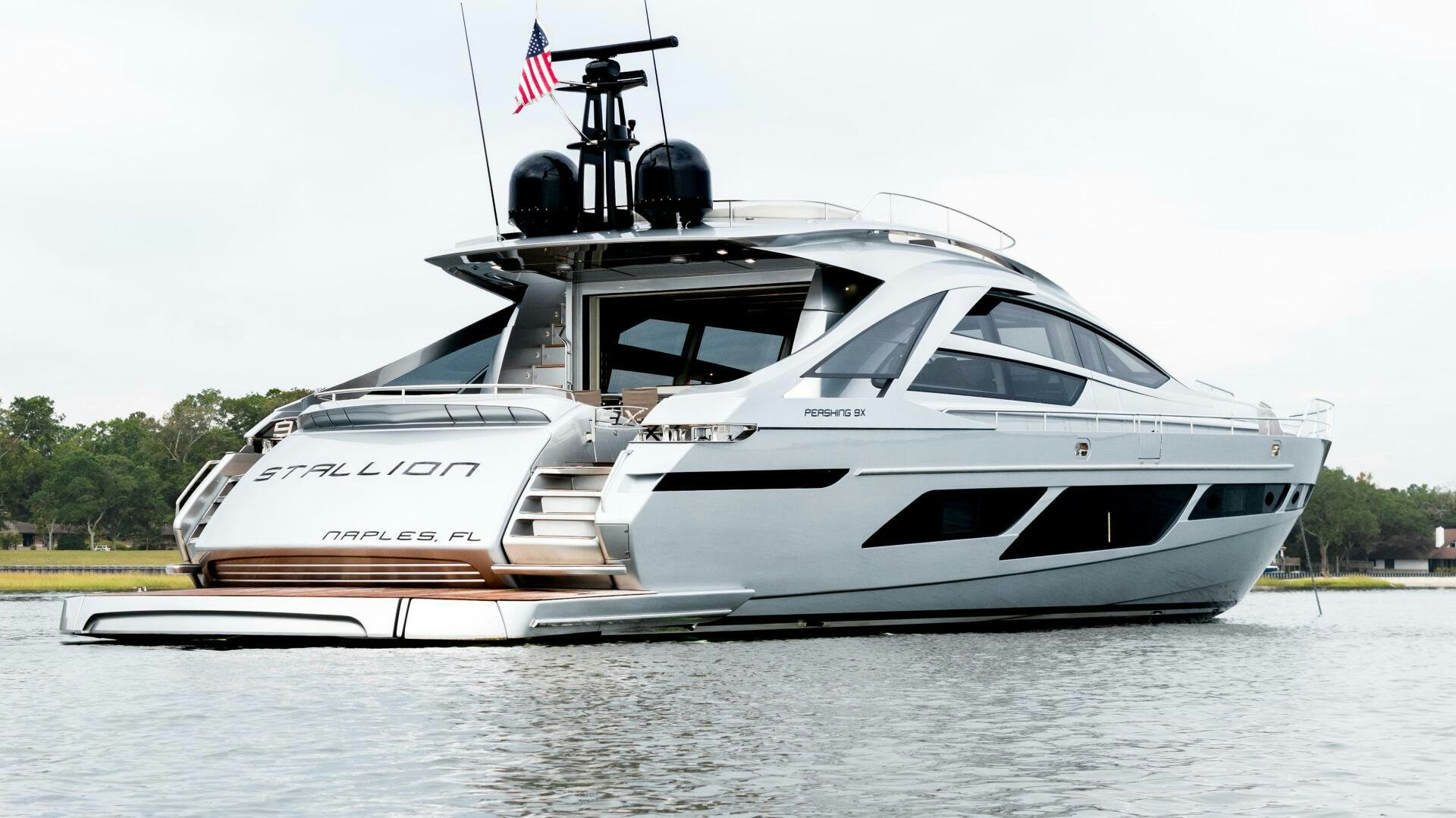 a white yacht on water aboard STALLION Yacht for Sale