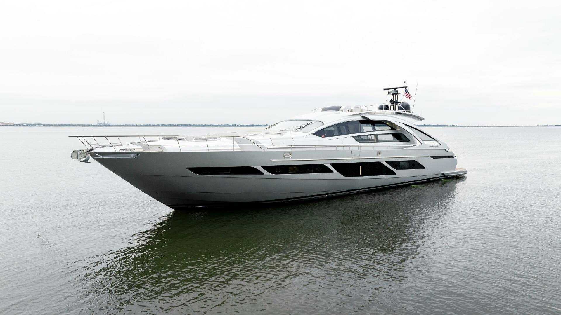 a white yacht in the water aboard STALLION Yacht for Sale
