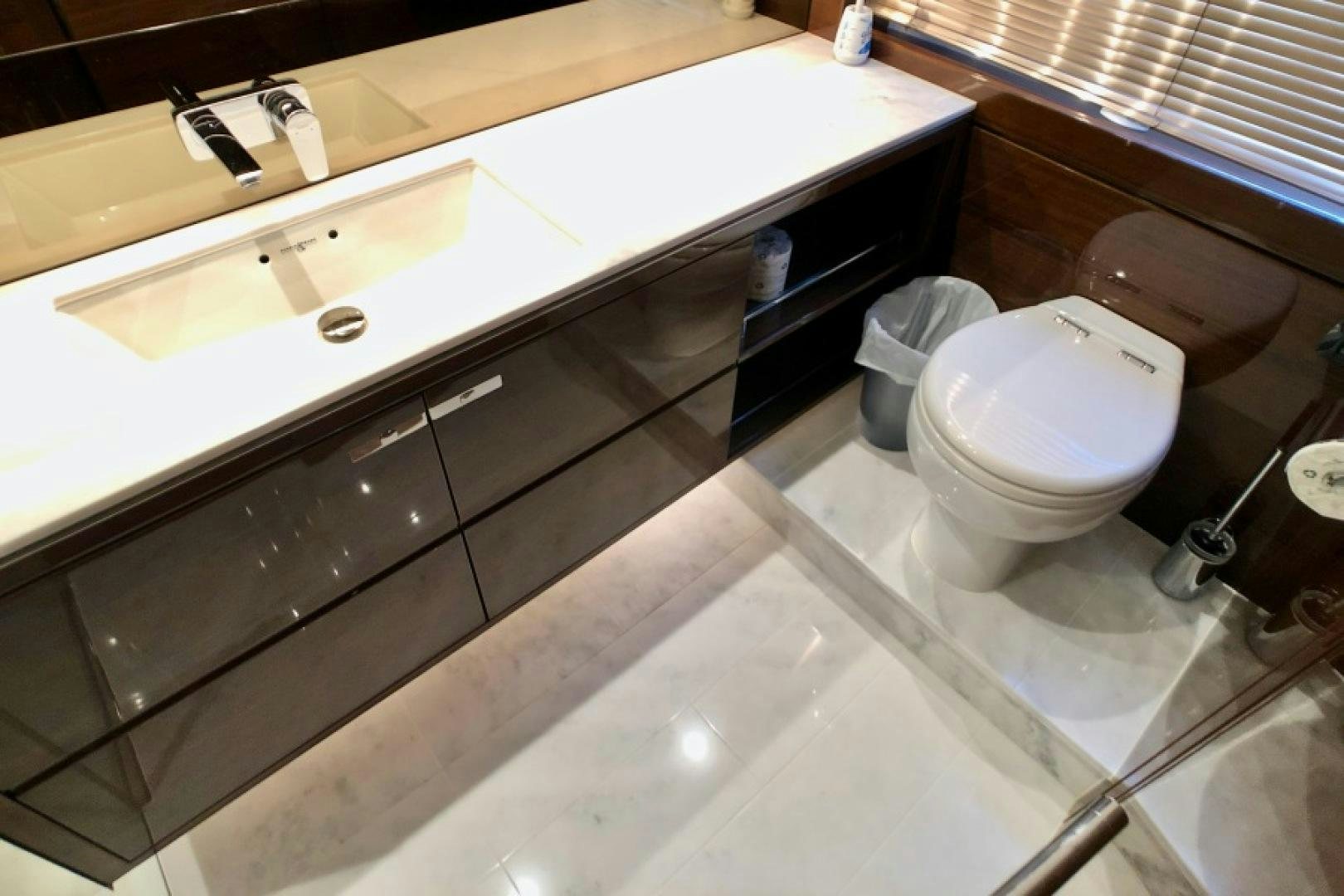 a bathroom with a sink and a toilet aboard THE O SHEAUX Yacht for Sale