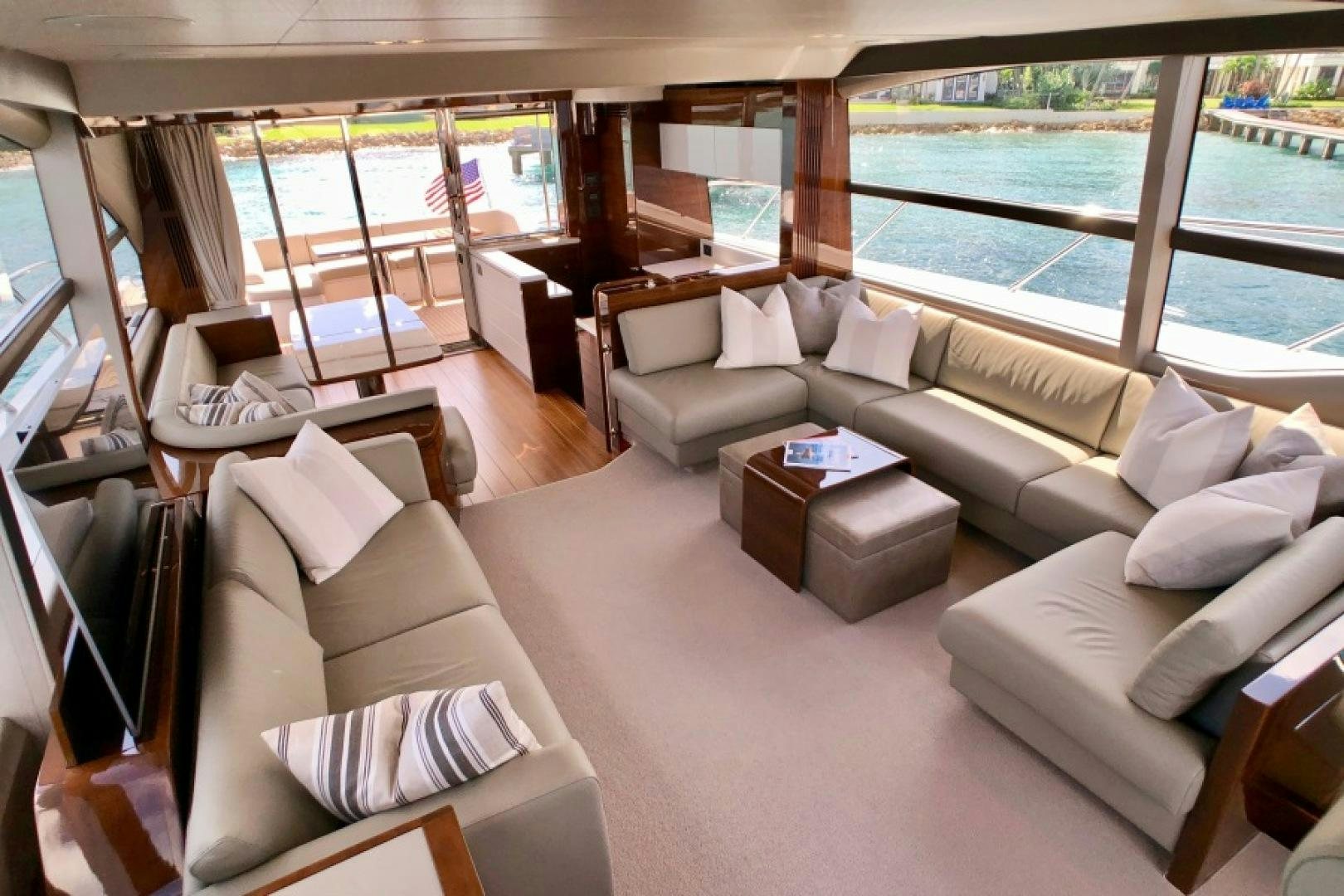 a living room with a large window aboard THE O SHEAUX Yacht for Sale