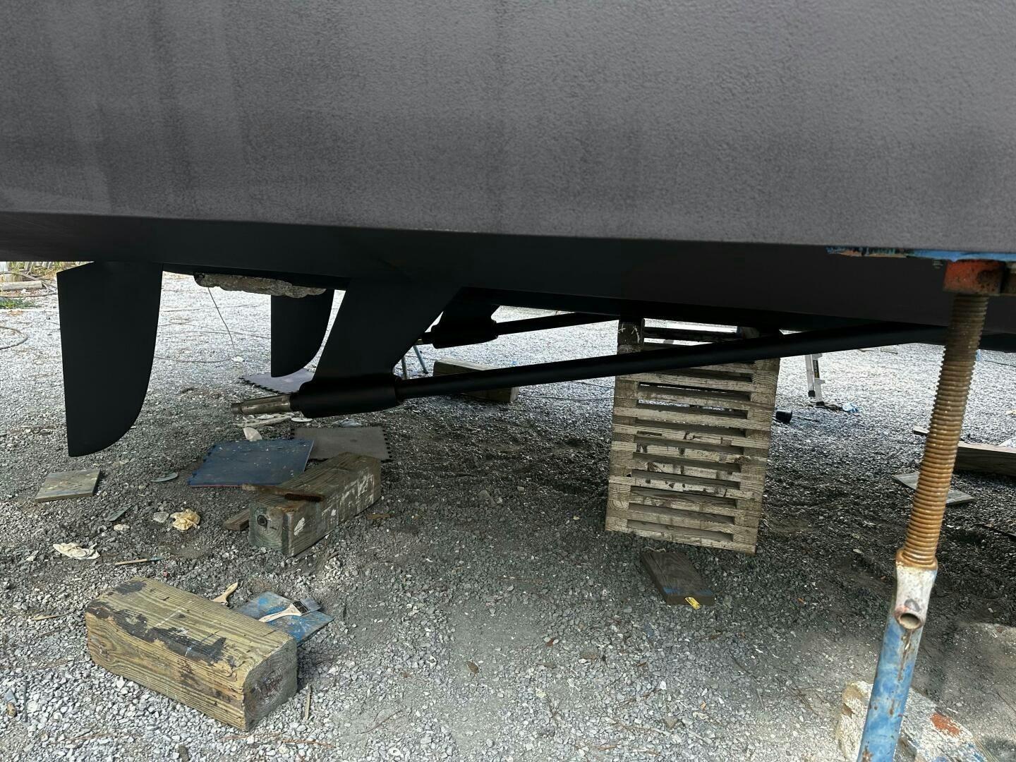 a black car with a blue bumper aboard THE O SHEAUX Yacht for Sale