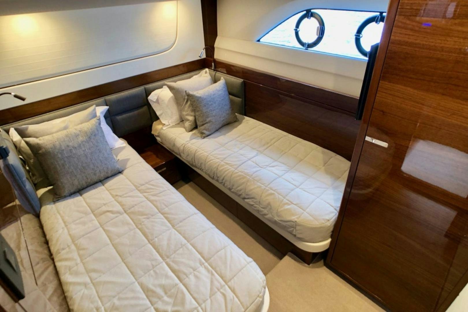 a bed with a white sheet and pillows on it aboard THE O SHEAUX Yacht for Sale