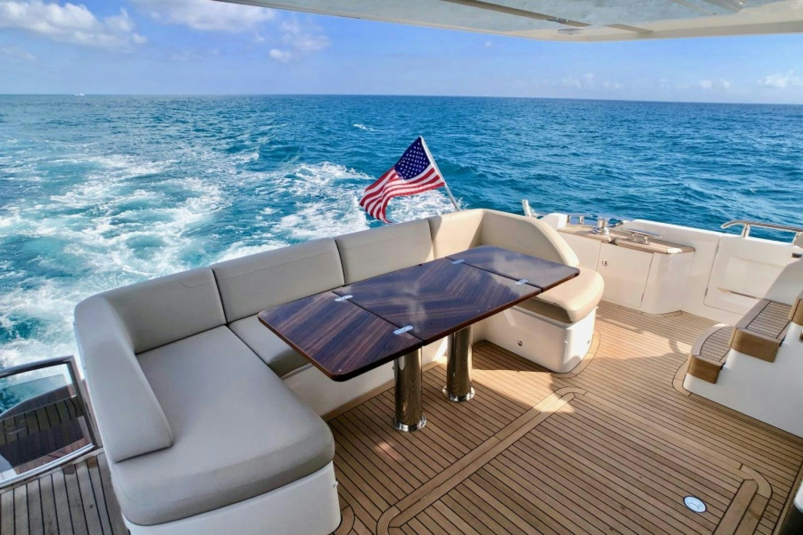 a lounge chair on a deck overlooking the ocean aboard THE O SHEAUX Yacht for Sale