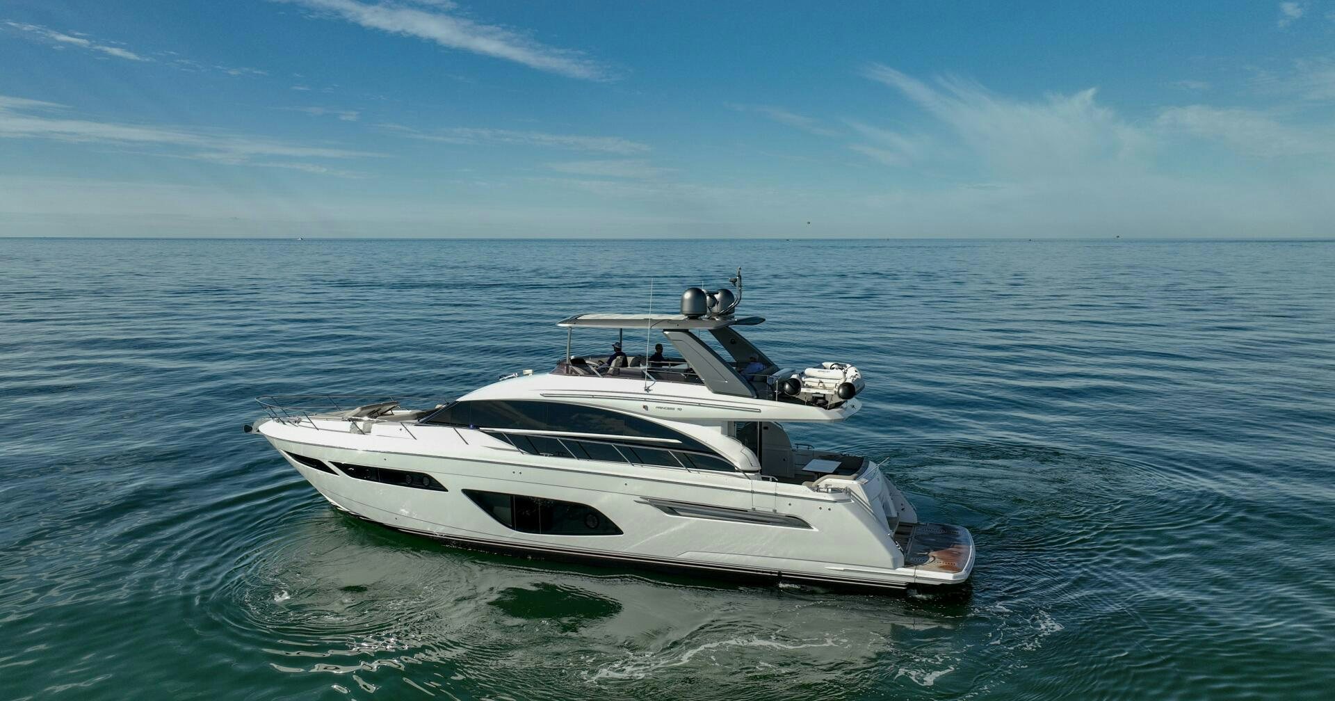 a white boat in the water aboard THE O SHEAUX Yacht for Sale