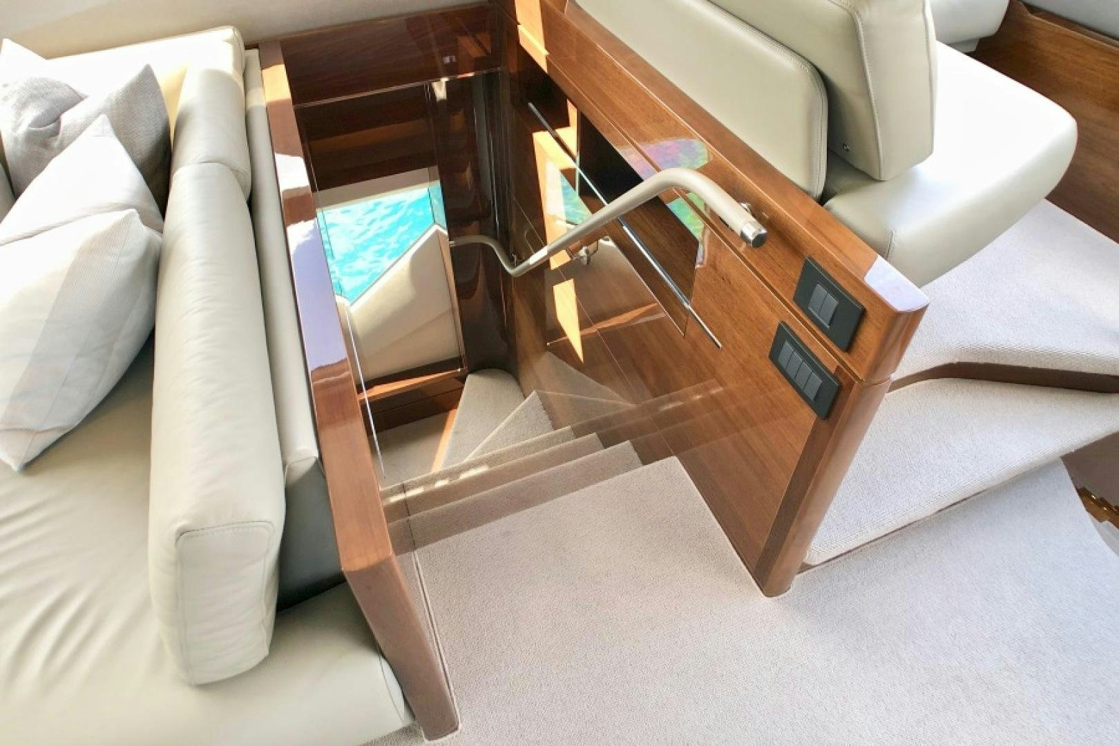 a chair with a table and a couch in the background aboard THE O SHEAUX Yacht for Sale