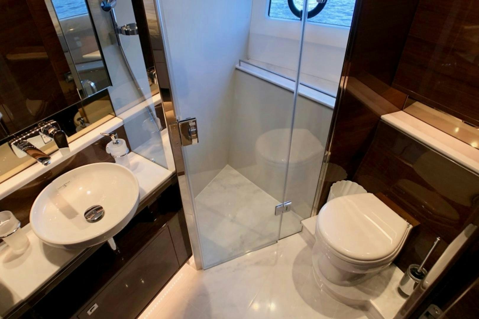 a bathroom with a sink and a toilet aboard THE O SHEAUX Yacht for Sale