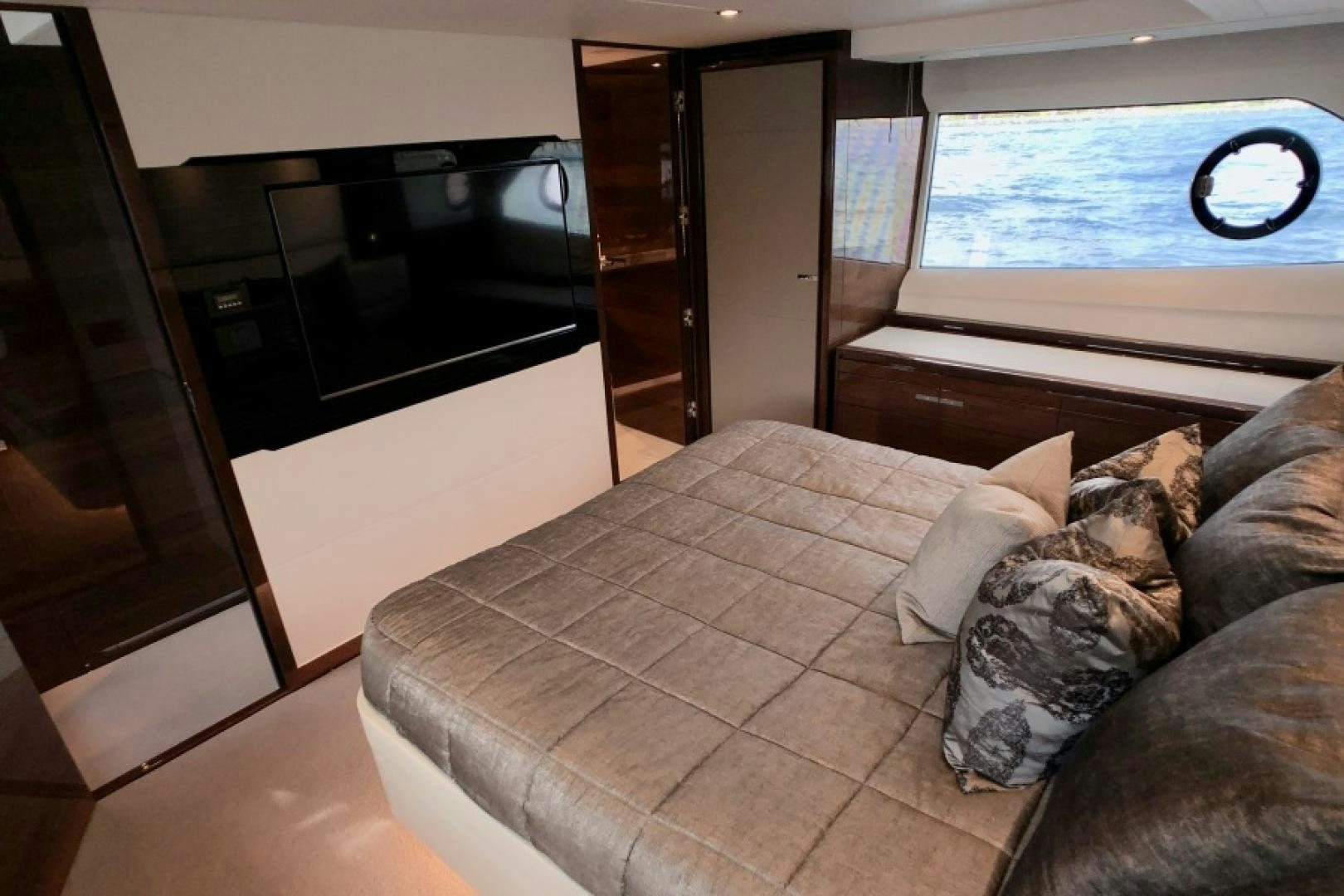a couch and a television in a room aboard THE O SHEAUX Yacht for Sale