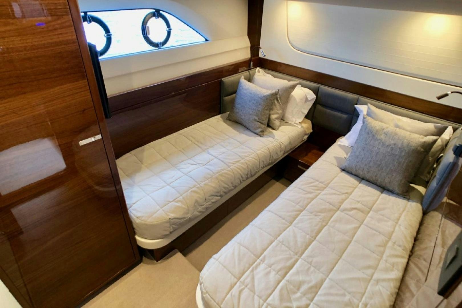 a bed with a white sheet and pillows aboard THE O SHEAUX Yacht for Sale
