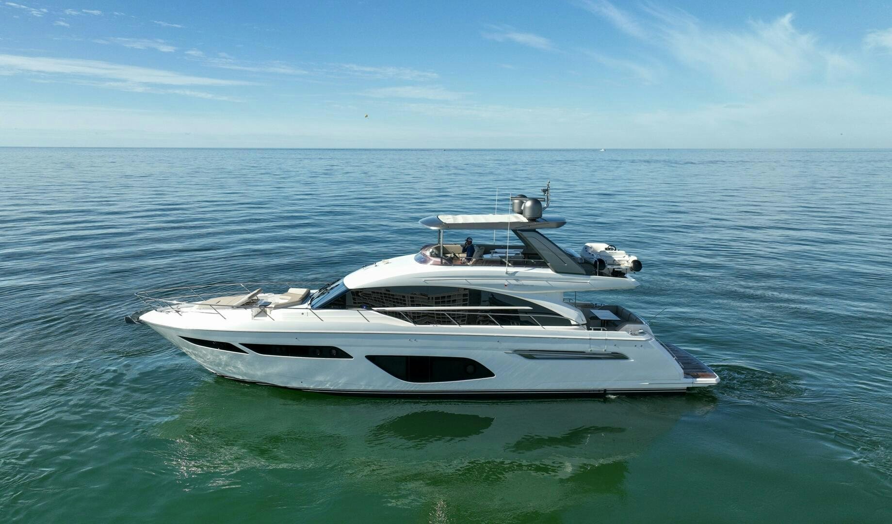 a white boat in the water aboard THE O SHEAUX Yacht for Sale