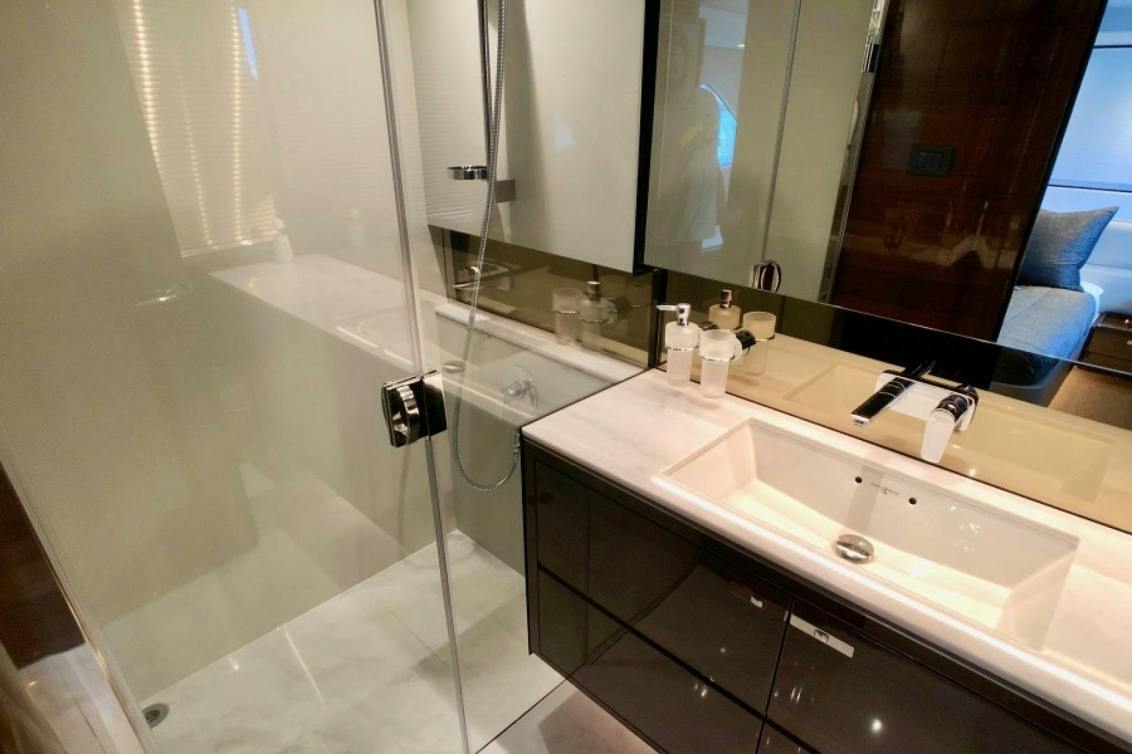 a bathroom with a large mirror aboard THE O SHEAUX Yacht for Sale