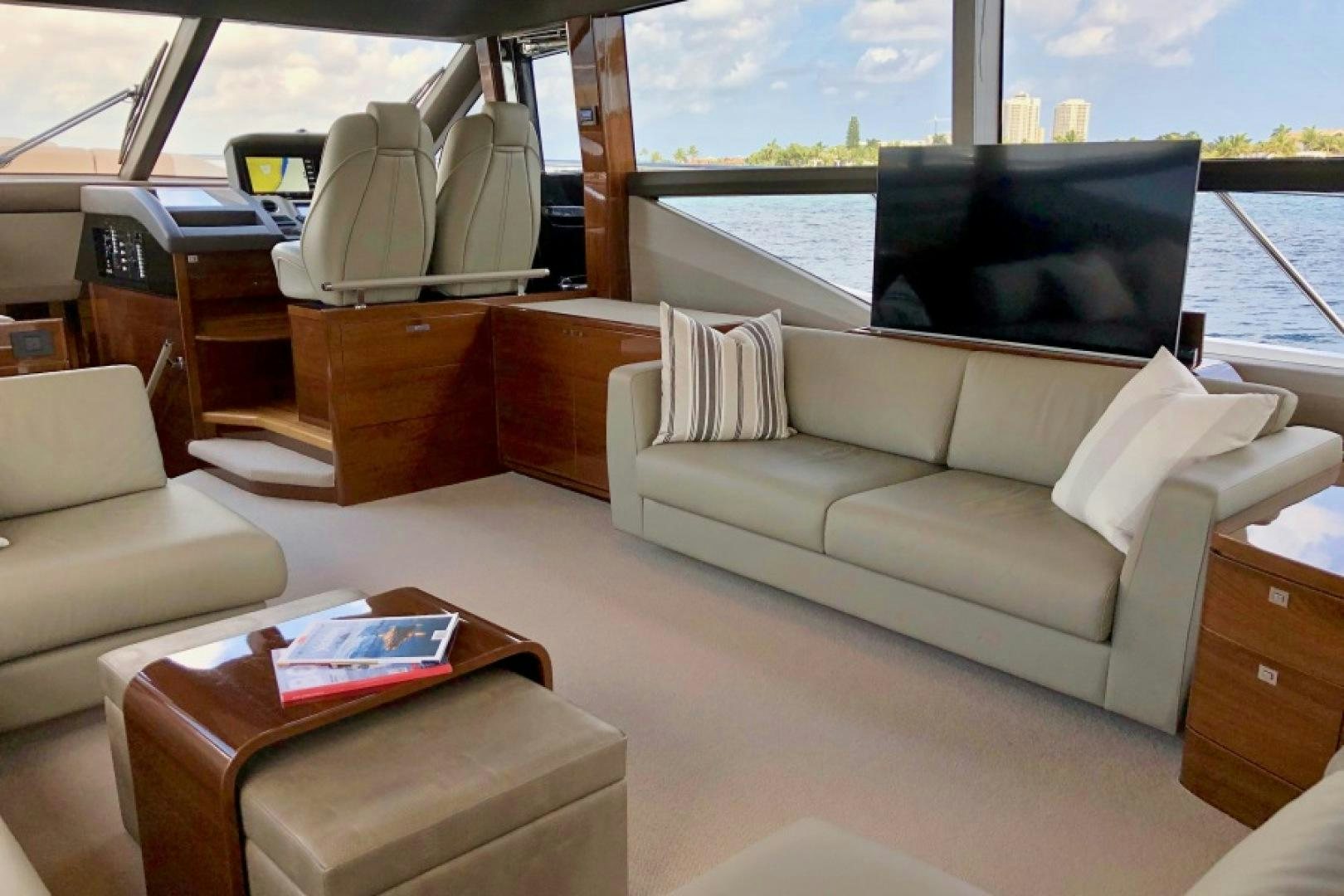 a living room with a large window aboard THE O SHEAUX Yacht for Sale
