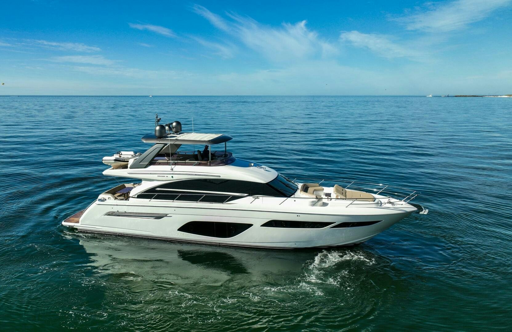 a white boat in the water aboard THE O SHEAUX Yacht for Sale