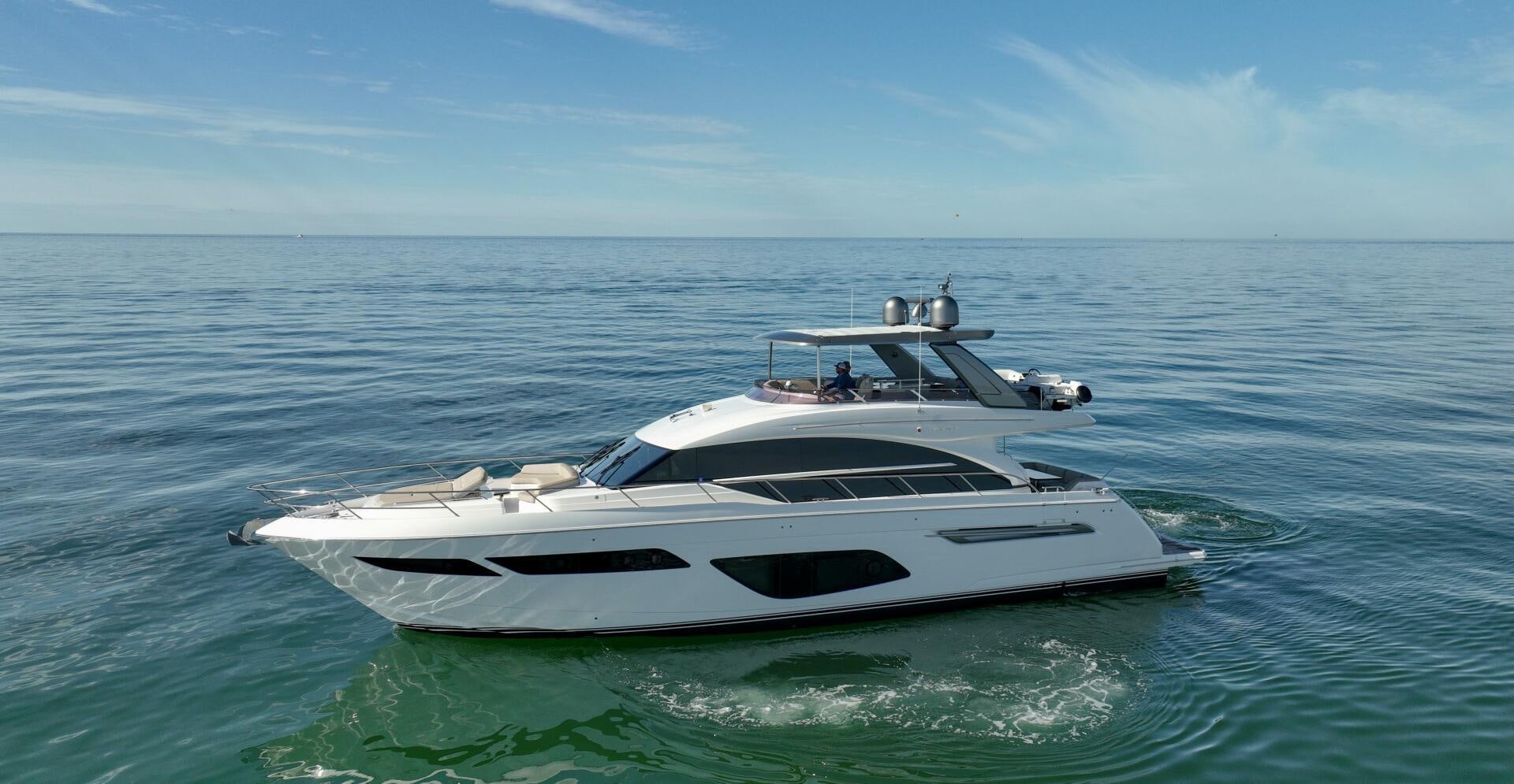 a white boat in the water aboard THE O SHEAUX Yacht for Sale