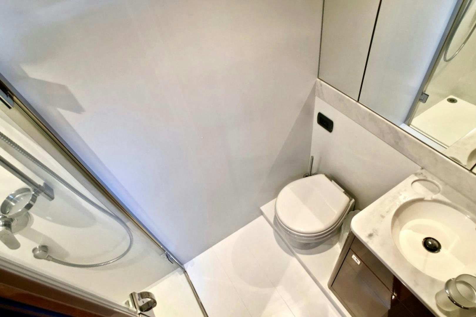a bathroom with a toilet and sink aboard THE O SHEAUX Yacht for Sale