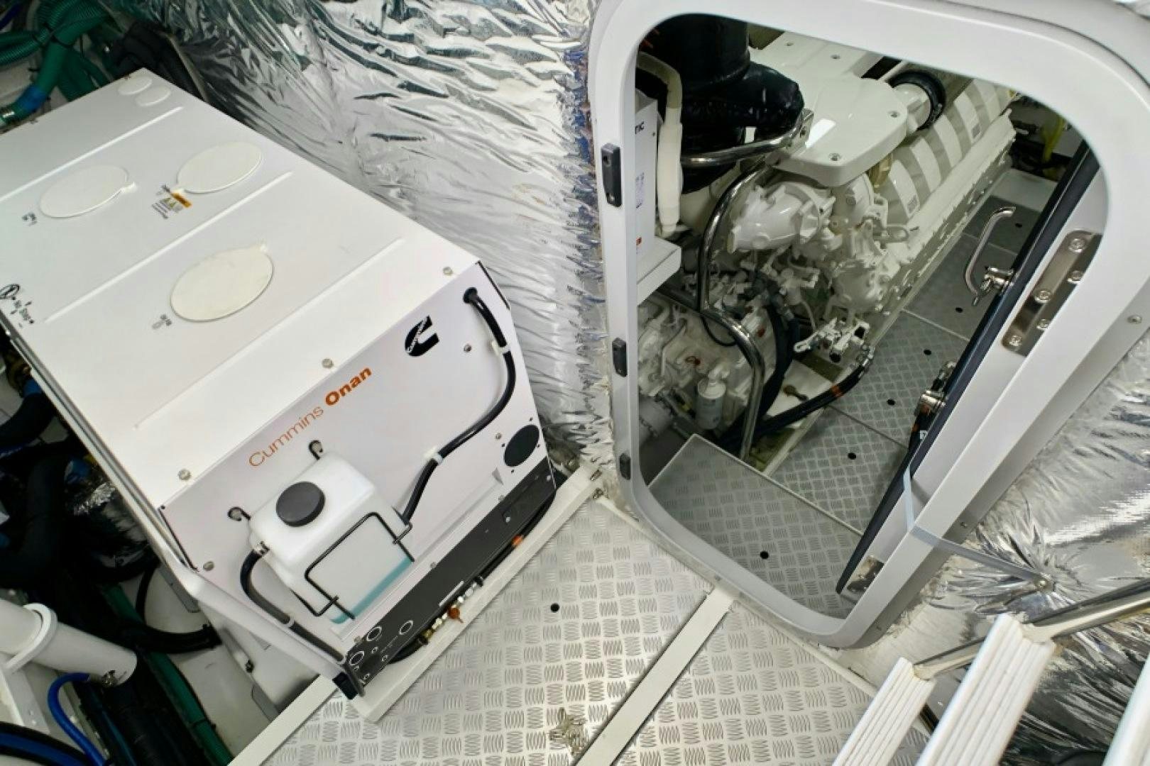 a white car with a white hood aboard THE O SHEAUX Yacht for Sale