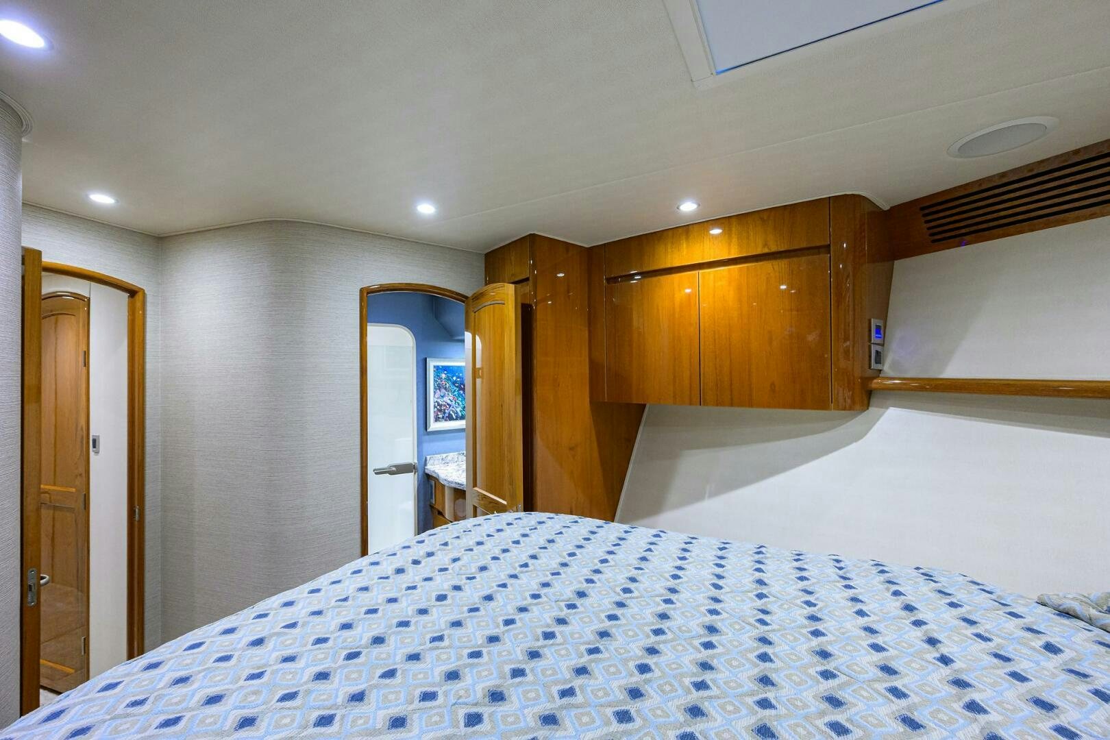 a large bedroom with a large bed aboard TORTA Yacht for Sale