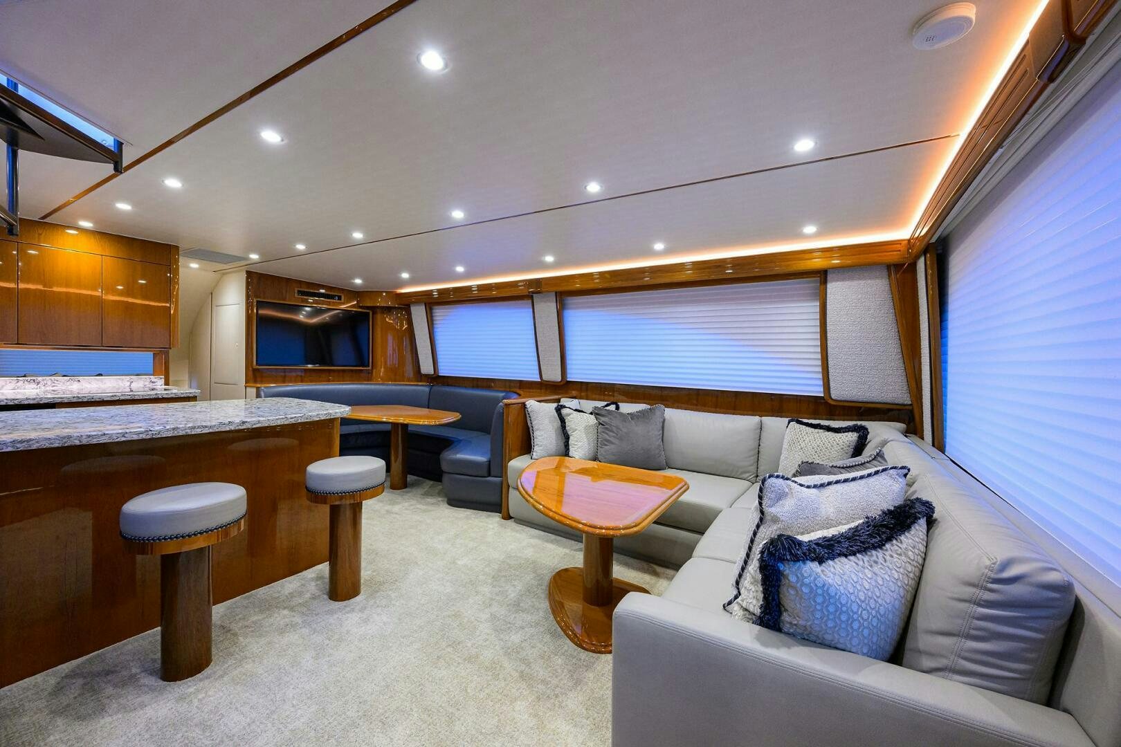 a living room with a couch and a table aboard TORTA Yacht for Sale