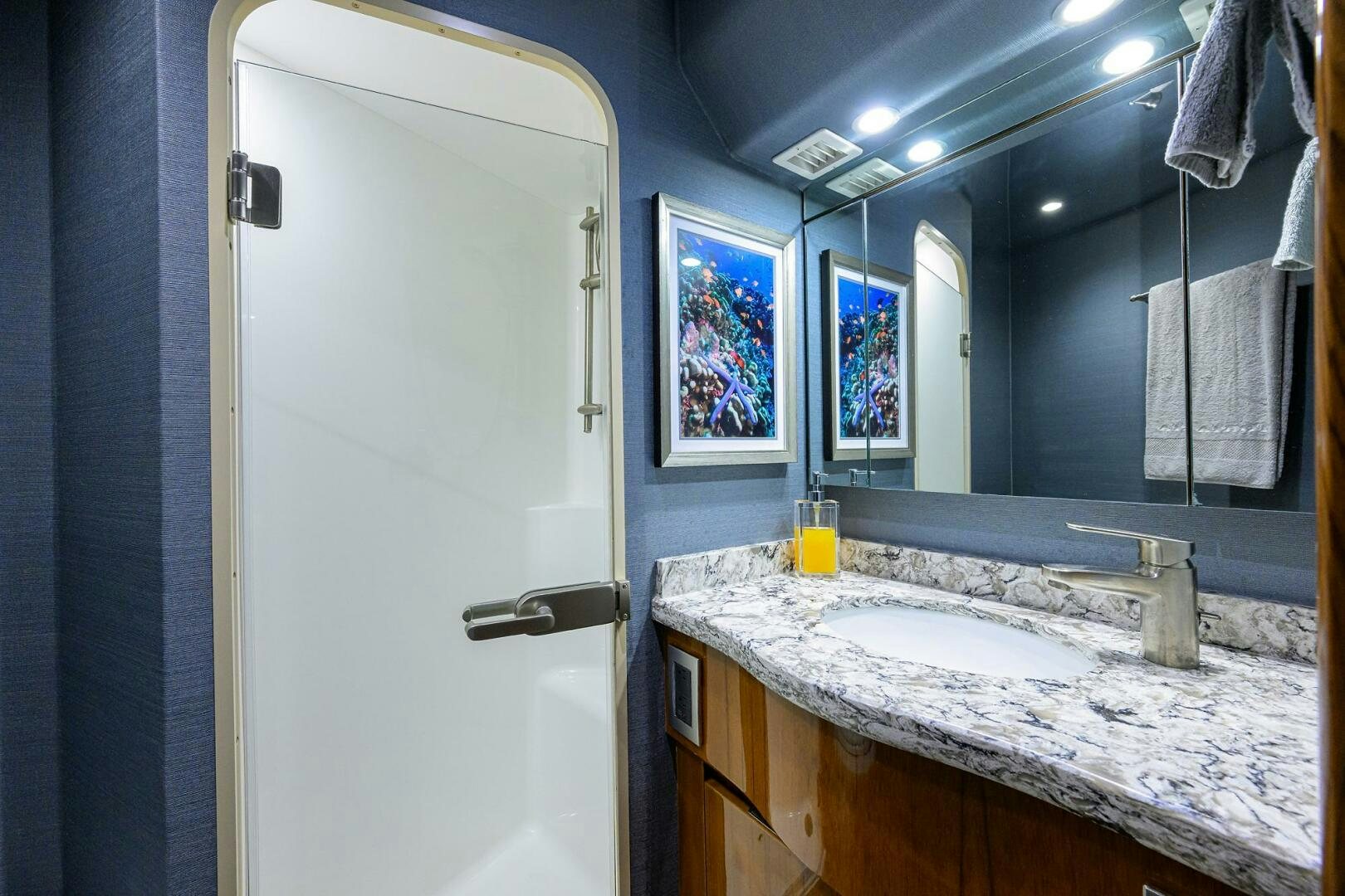 a bathroom with a countertop sink and a mirror aboard TORTA Yacht for Sale