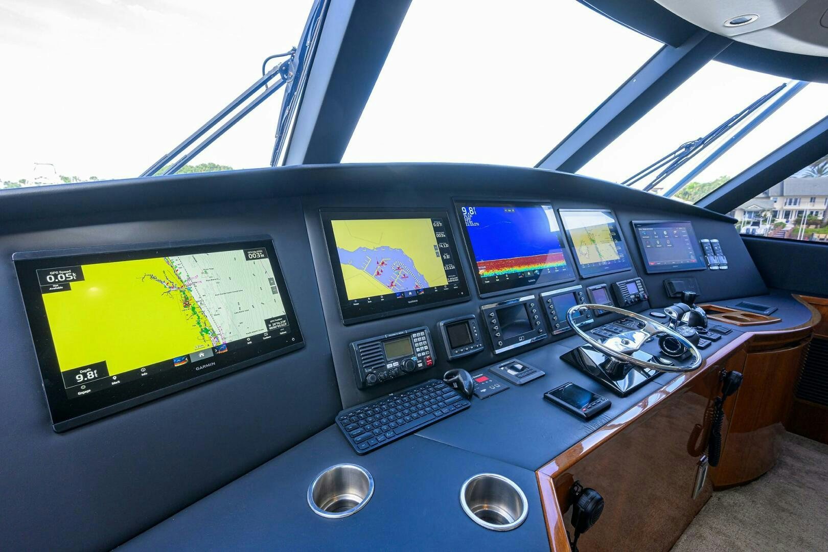 a group of monitors and keyboards on a table aboard TORTA Yacht for Sale