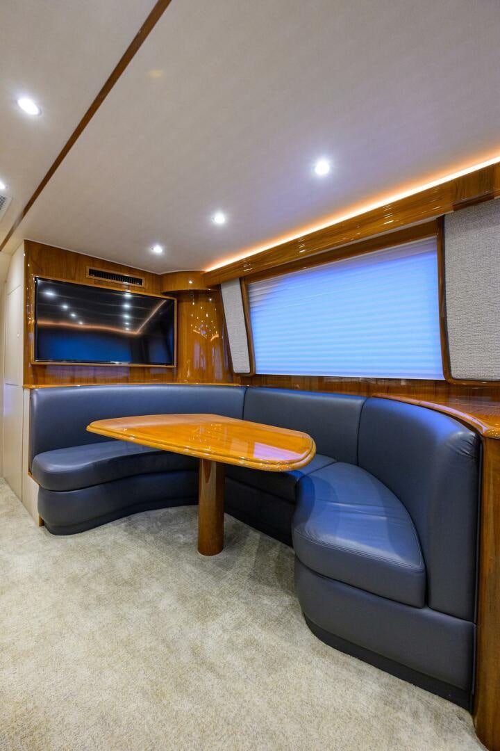 a room with a couch and a table aboard TORTA Yacht for Sale