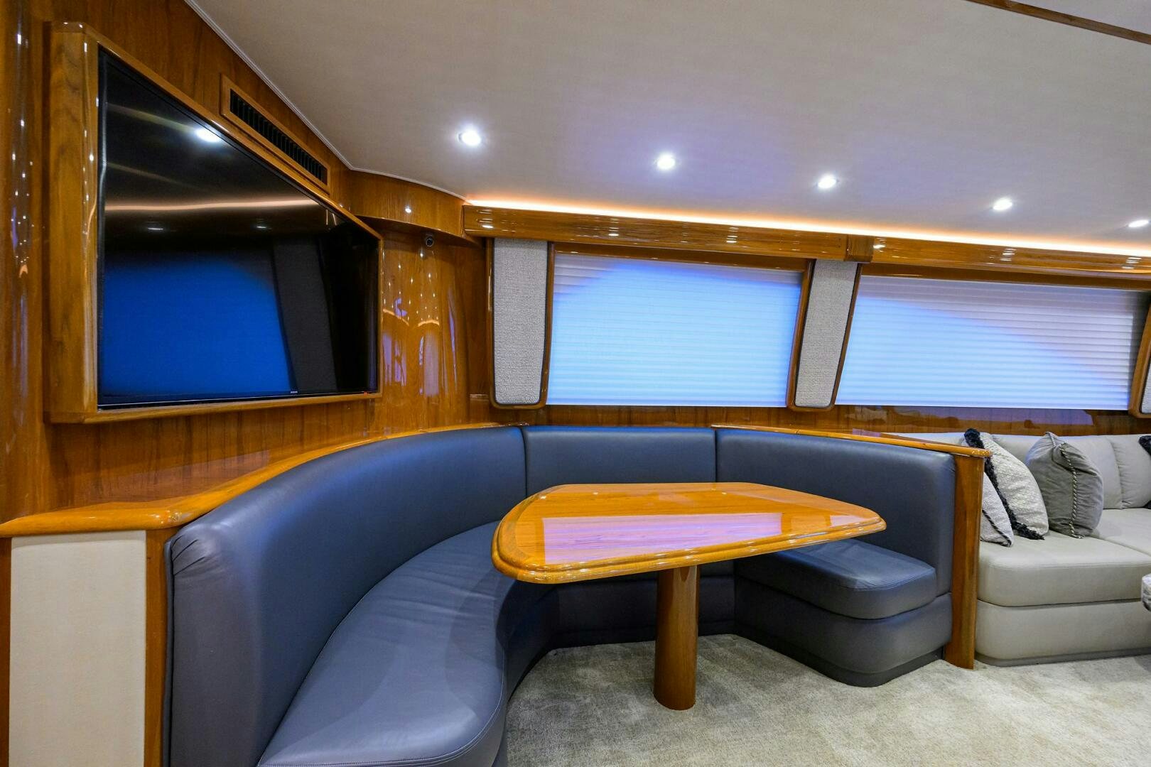 a living room with a couch and a coffee table aboard TORTA Yacht for Sale