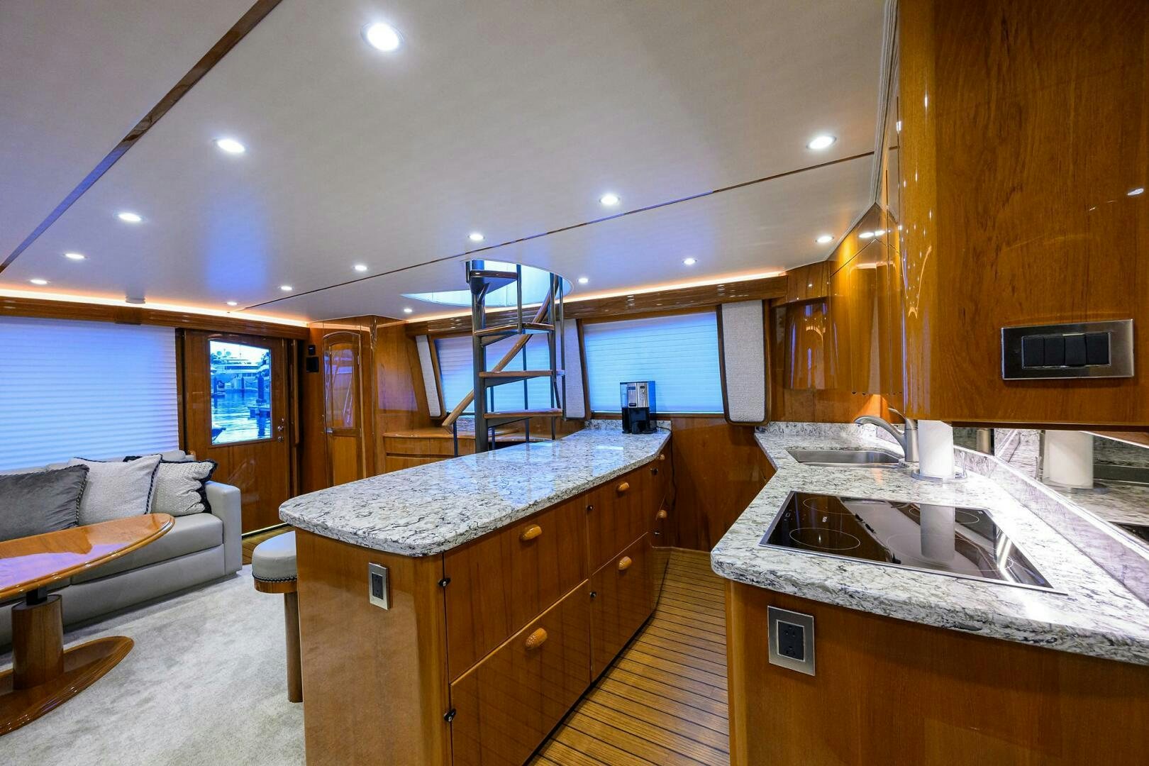a kitchen with a sink and a couch aboard TORTA Yacht for Sale