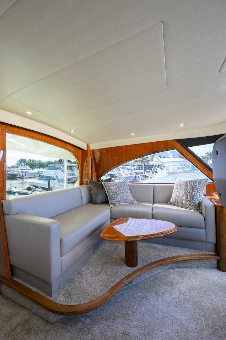 a living room with a couch and a table aboard TORTA Yacht for Sale