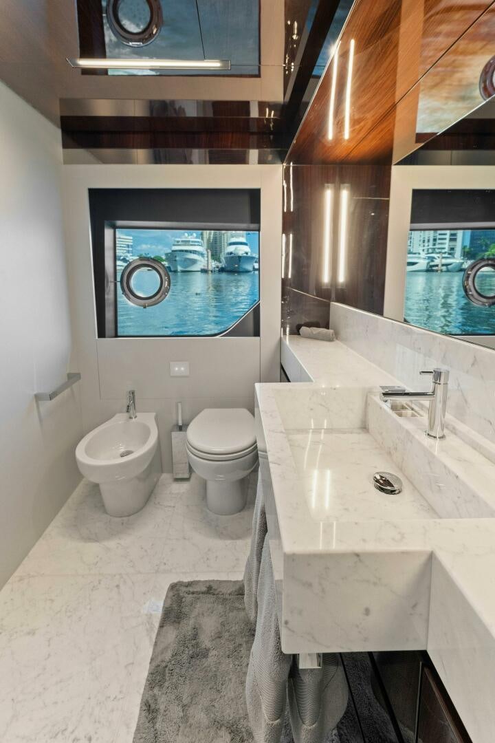 a bathroom with a large mirror aboard 110' RIVA DOLCEVITA 2024 Yacht for Sale