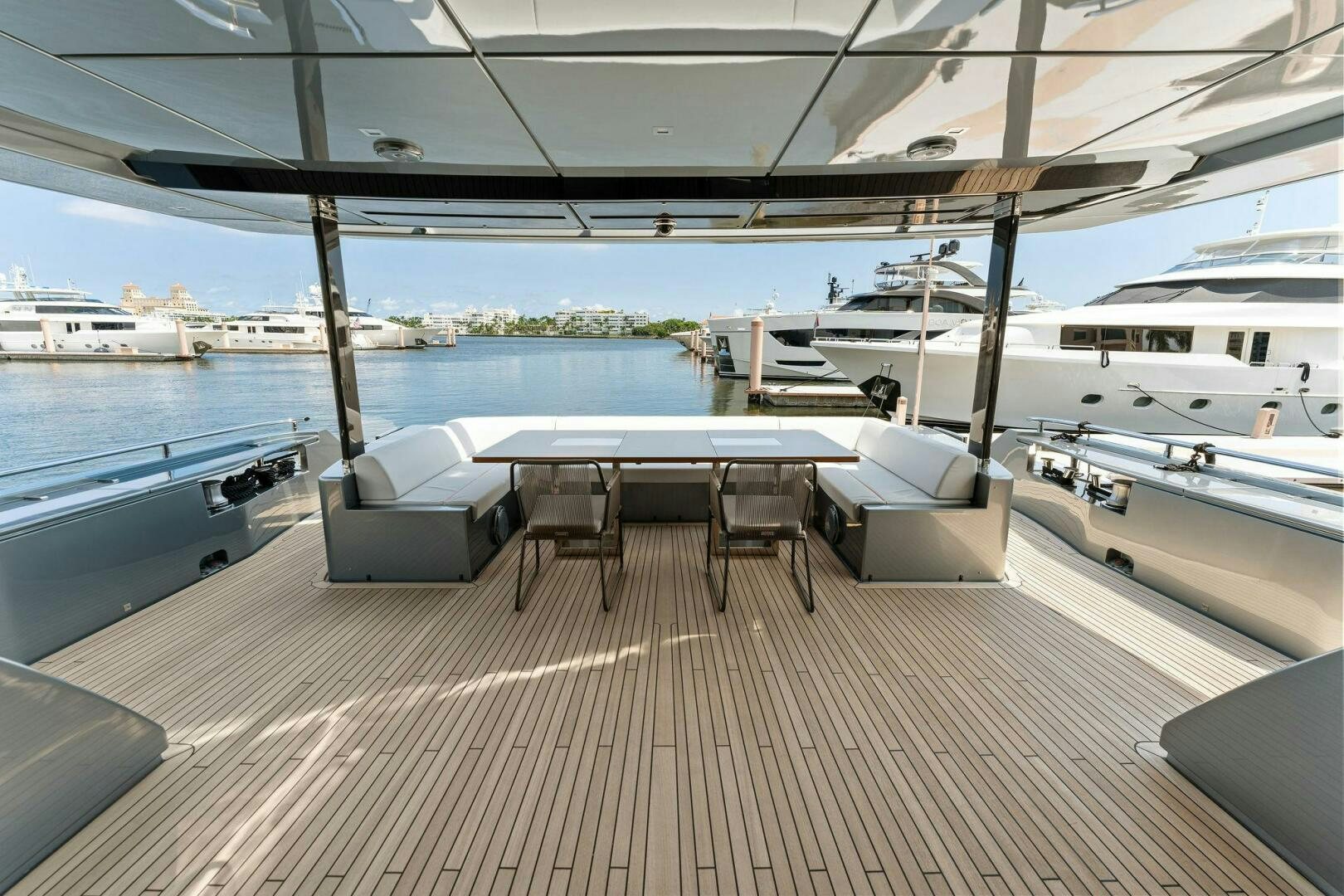 a room with a table and chairs aboard 110' RIVA DOLCEVITA 2024 Yacht for Sale